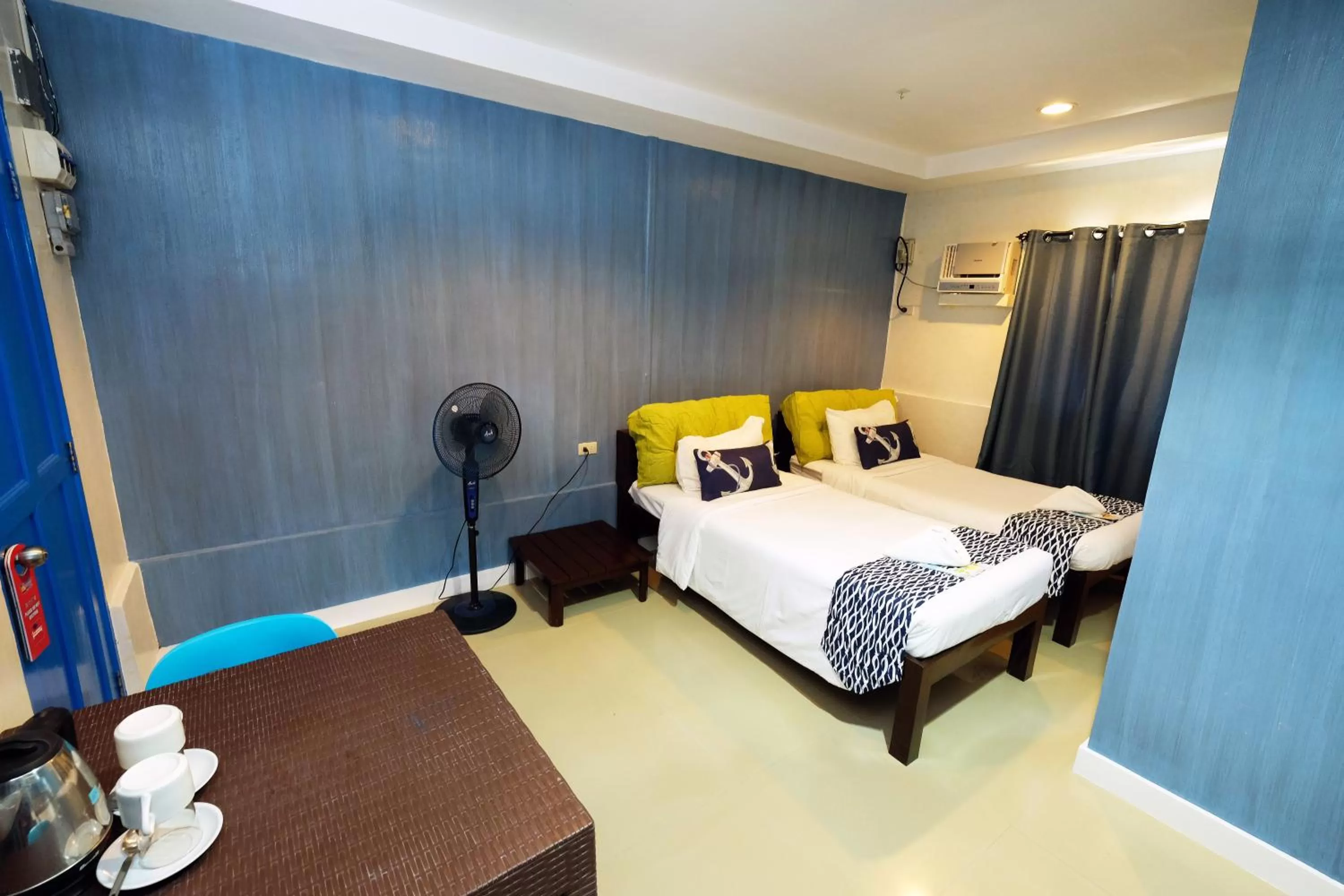 Bed in Pescadores Suites Moalboal