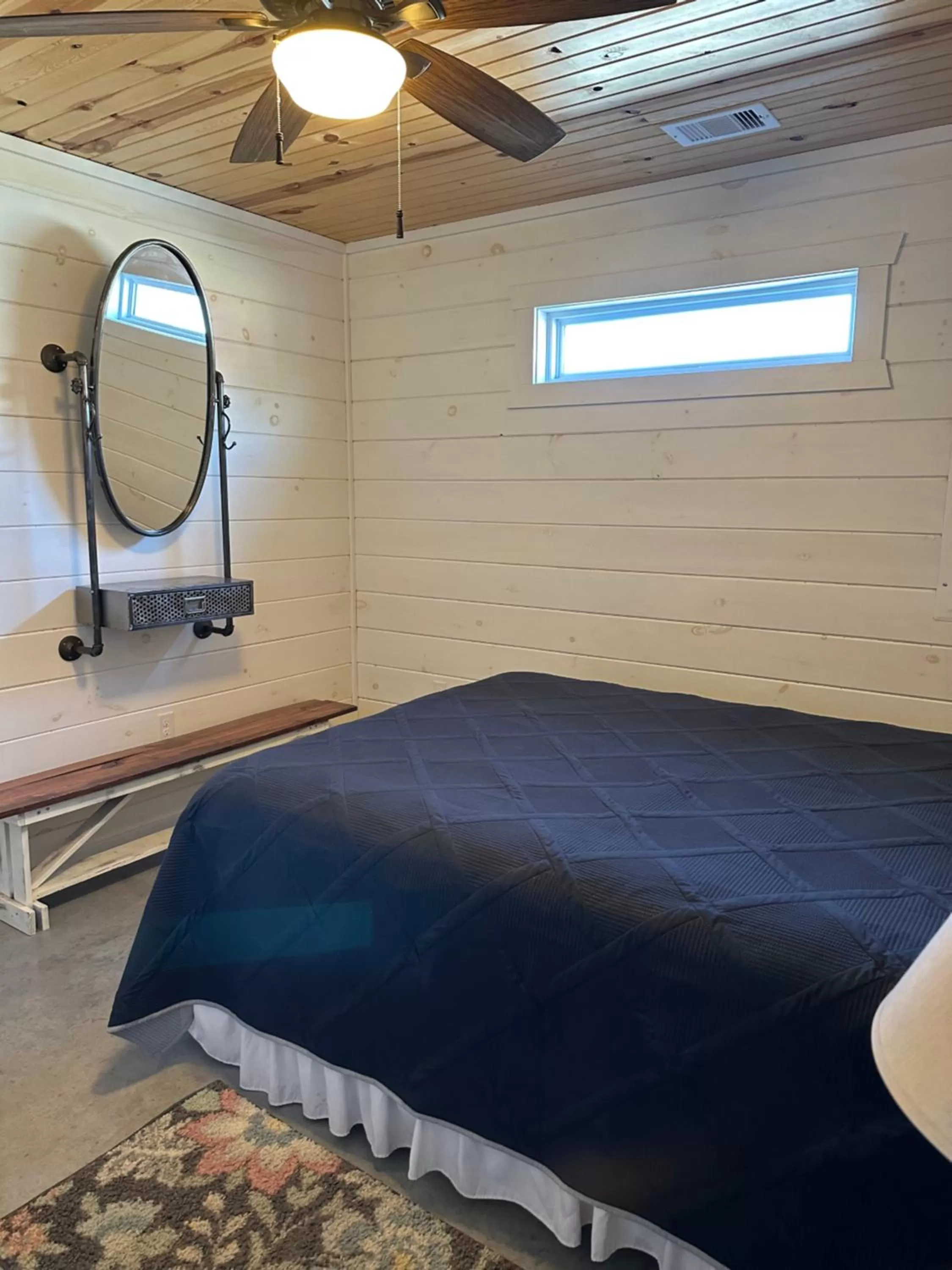 Bed in Knotty Squirrel Cabins