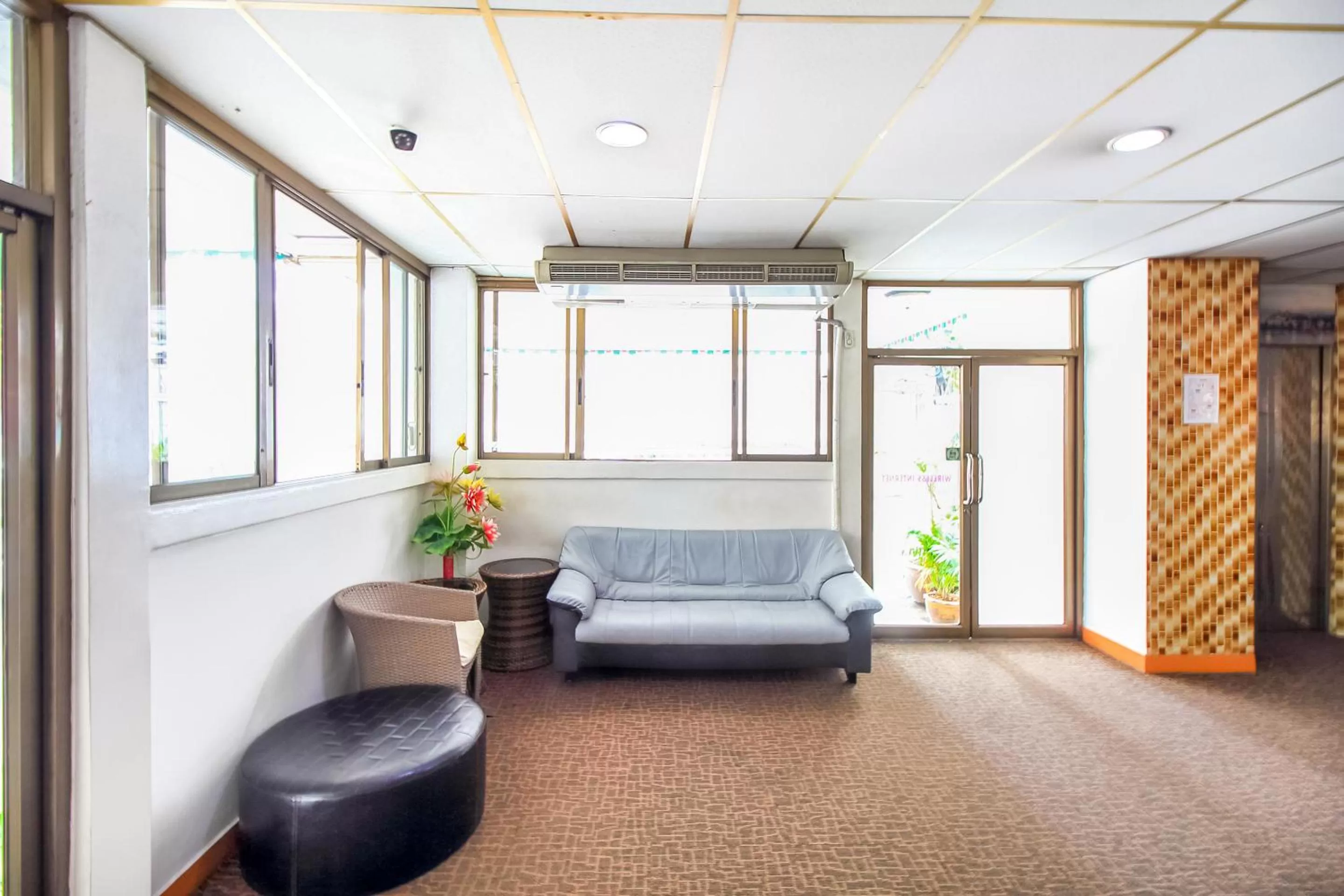 Seating area, Bed in Crown BTS Nana Hotel