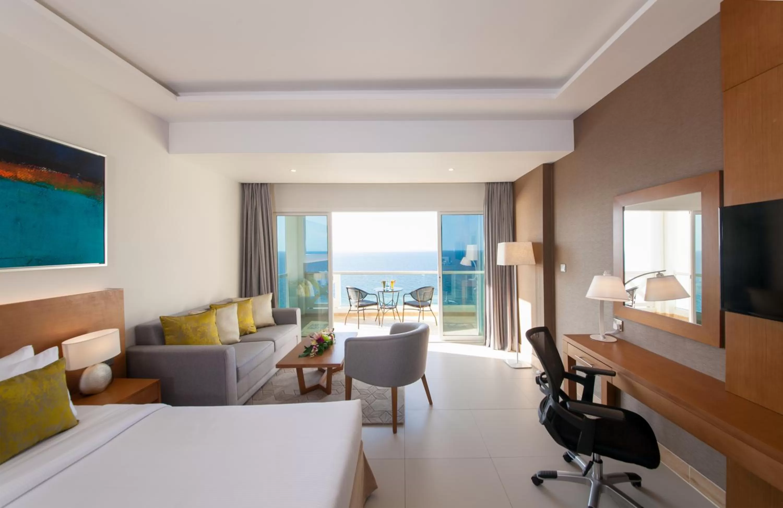 Balcony/Terrace, Bed in Ramada by Wyndham Beach Hotel Ajman