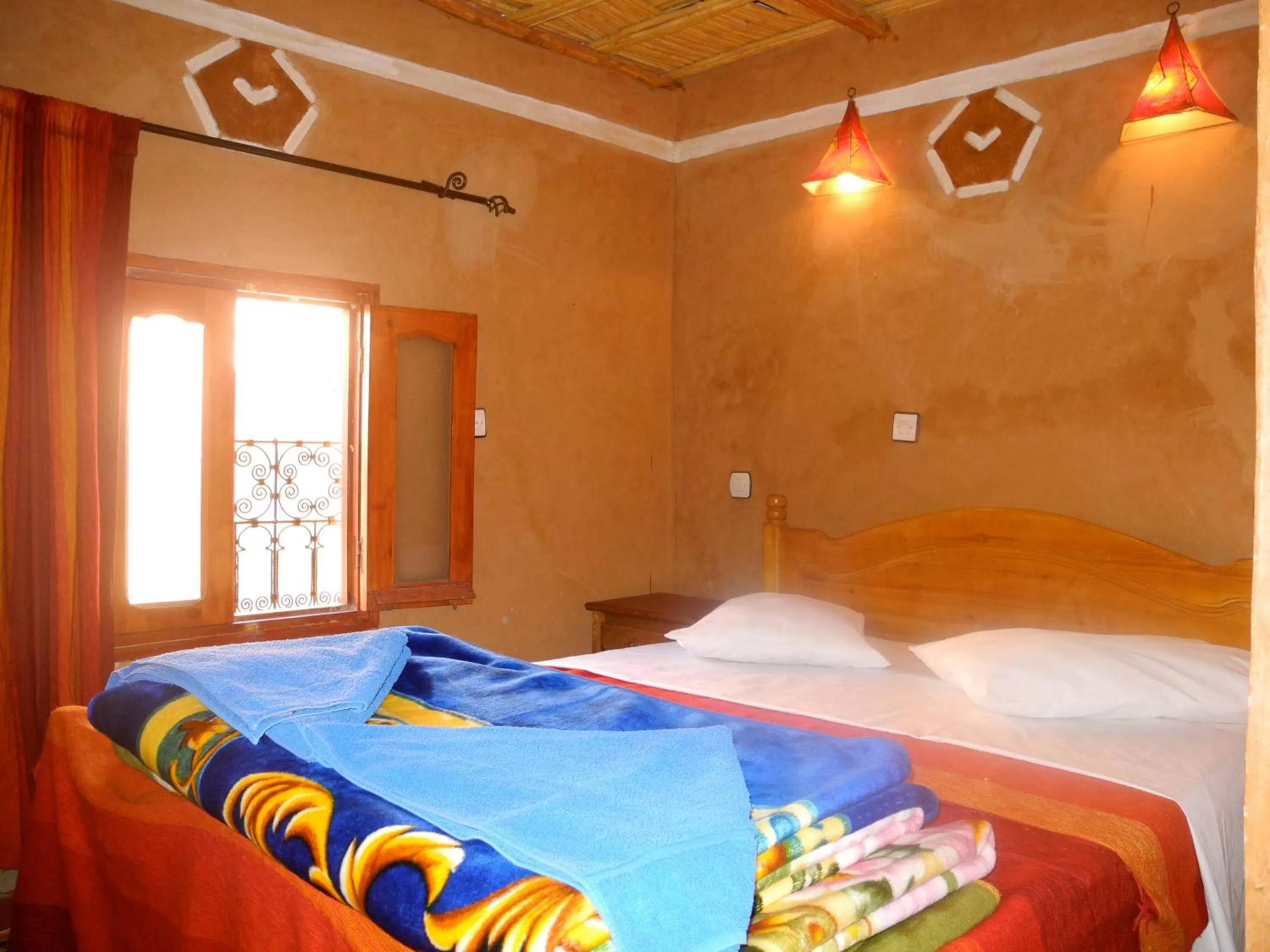 Bed in Maison d'Hôte Valentine