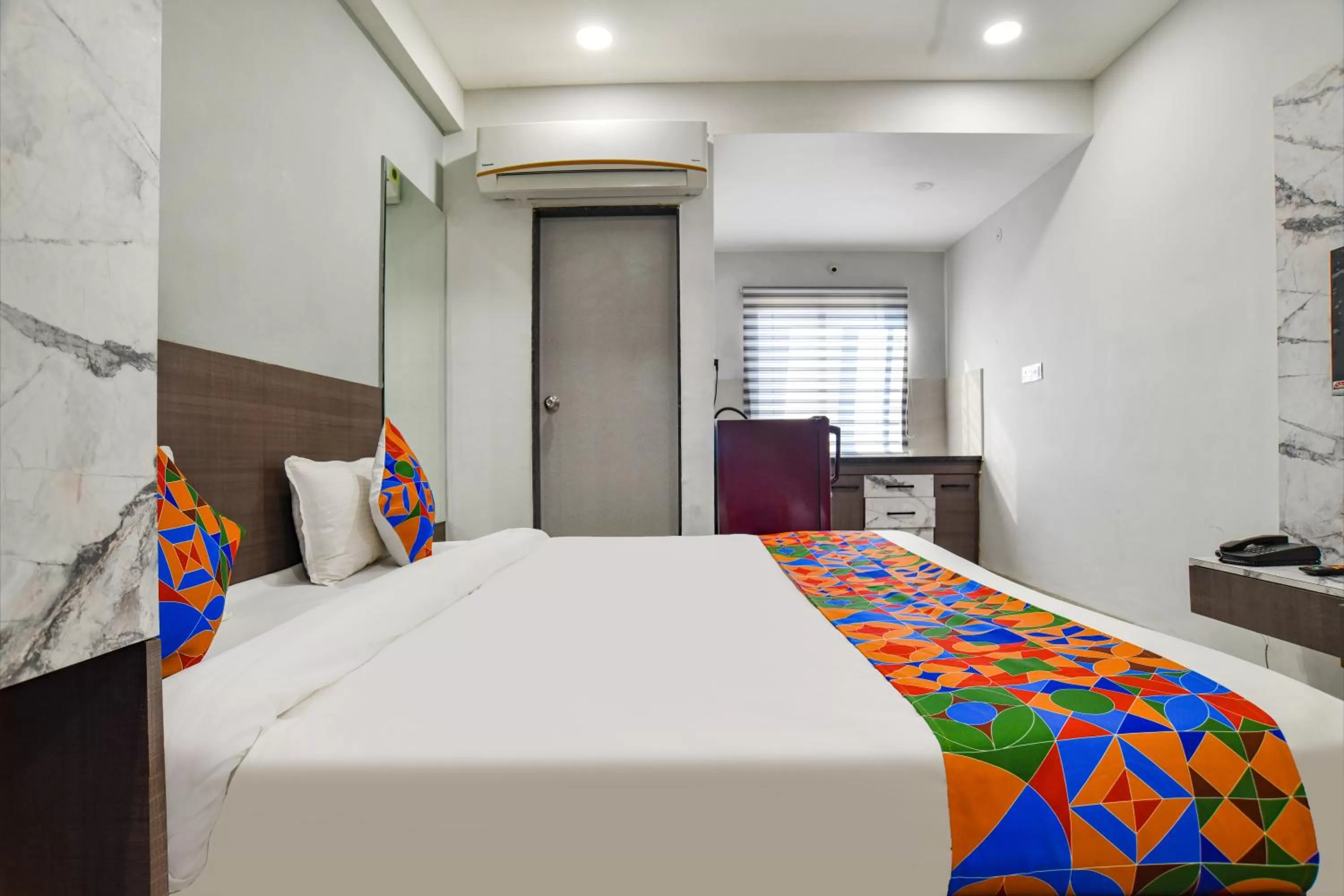 Photo of the whole room, Bed in Fabhotel Grand Blue