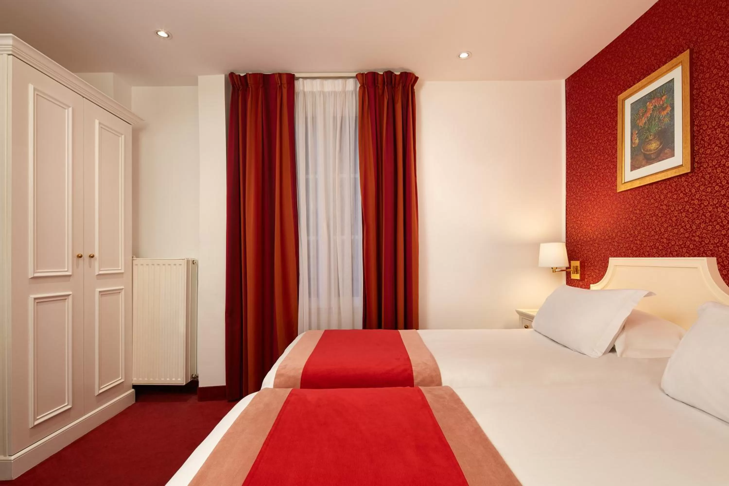 Bed in Austin's Arts Et Metiers Hotel