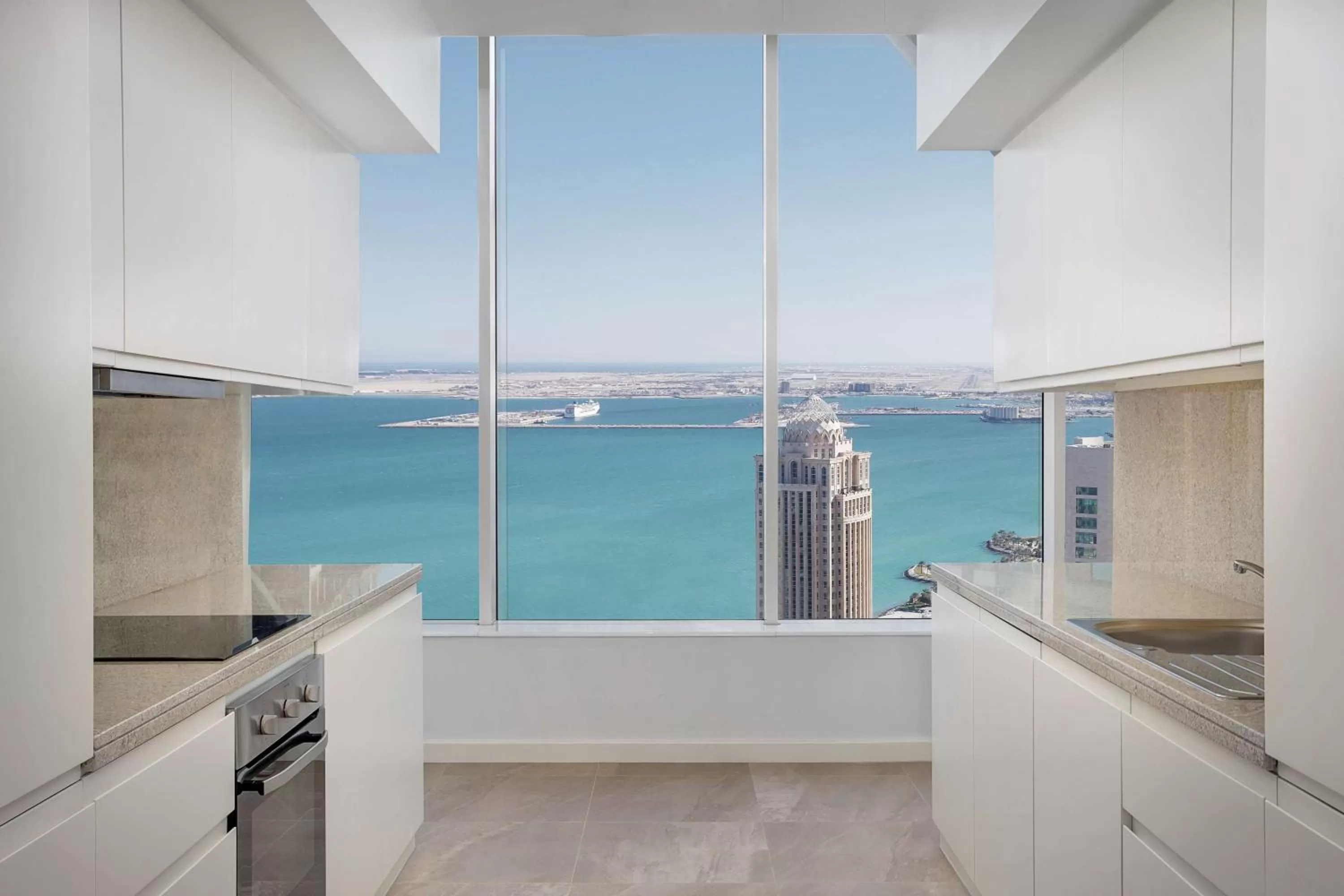 Kitchen or kitchenette in Aleph Doha Residences, Curio Collection By Hilton