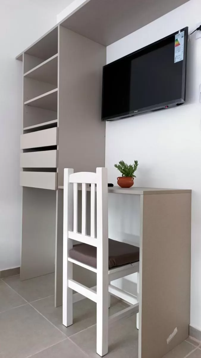 TV and multimedia, TV/Entertainment Center in Hotel Musto