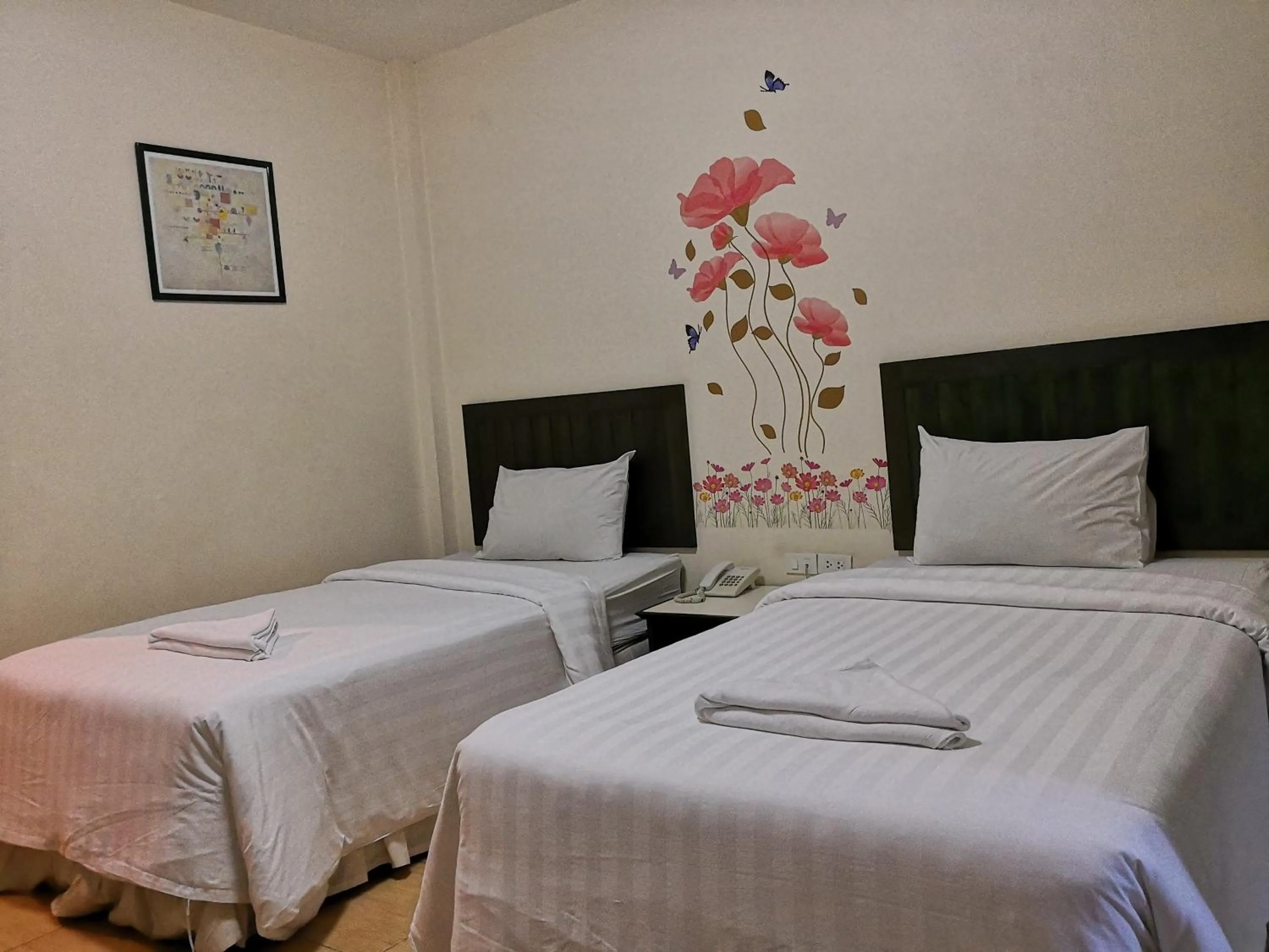 Bed in Baan Suksiri Hotel