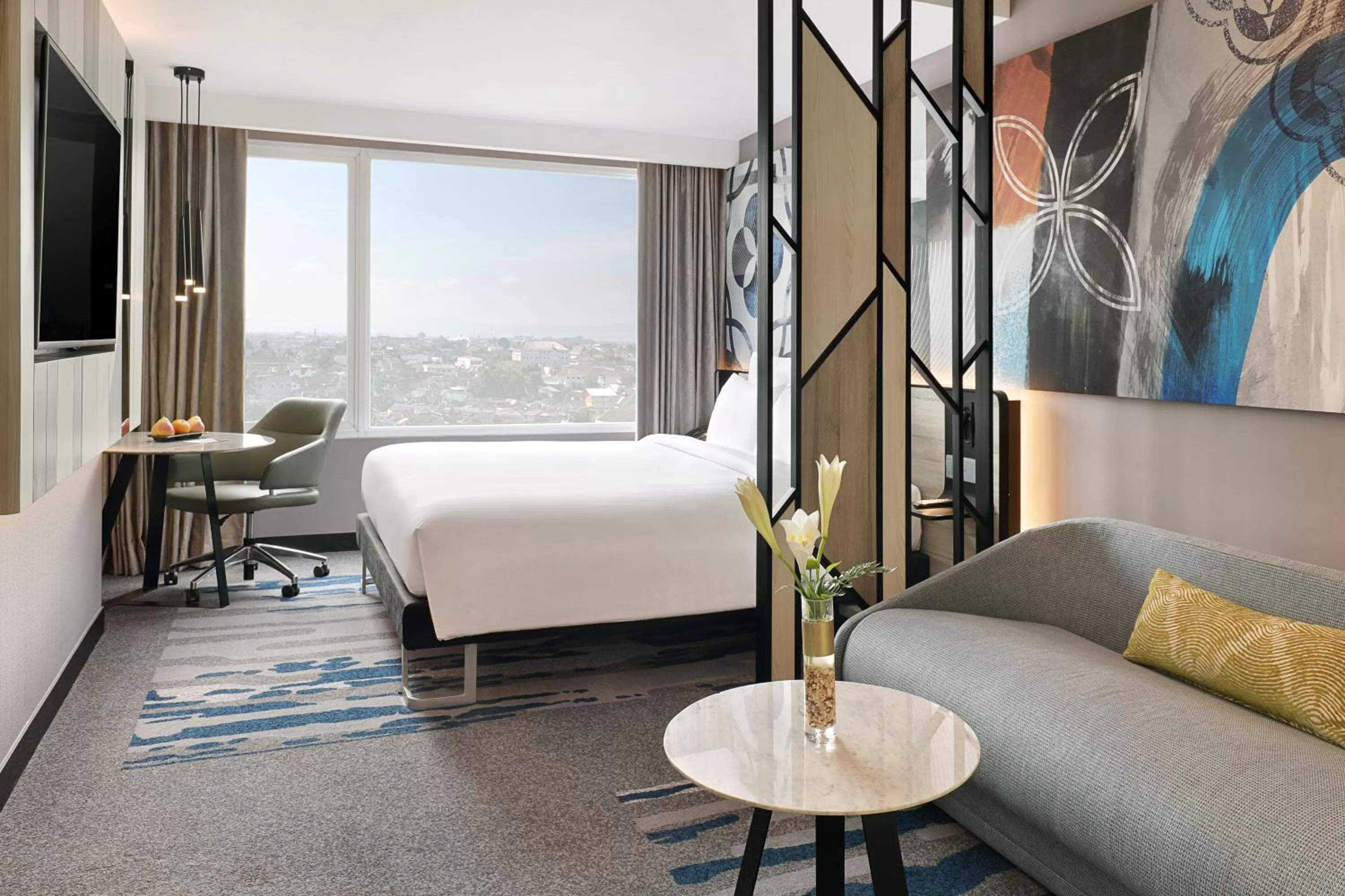 Living room, Bed in Novotel Suites Yogyakarta Malioboro