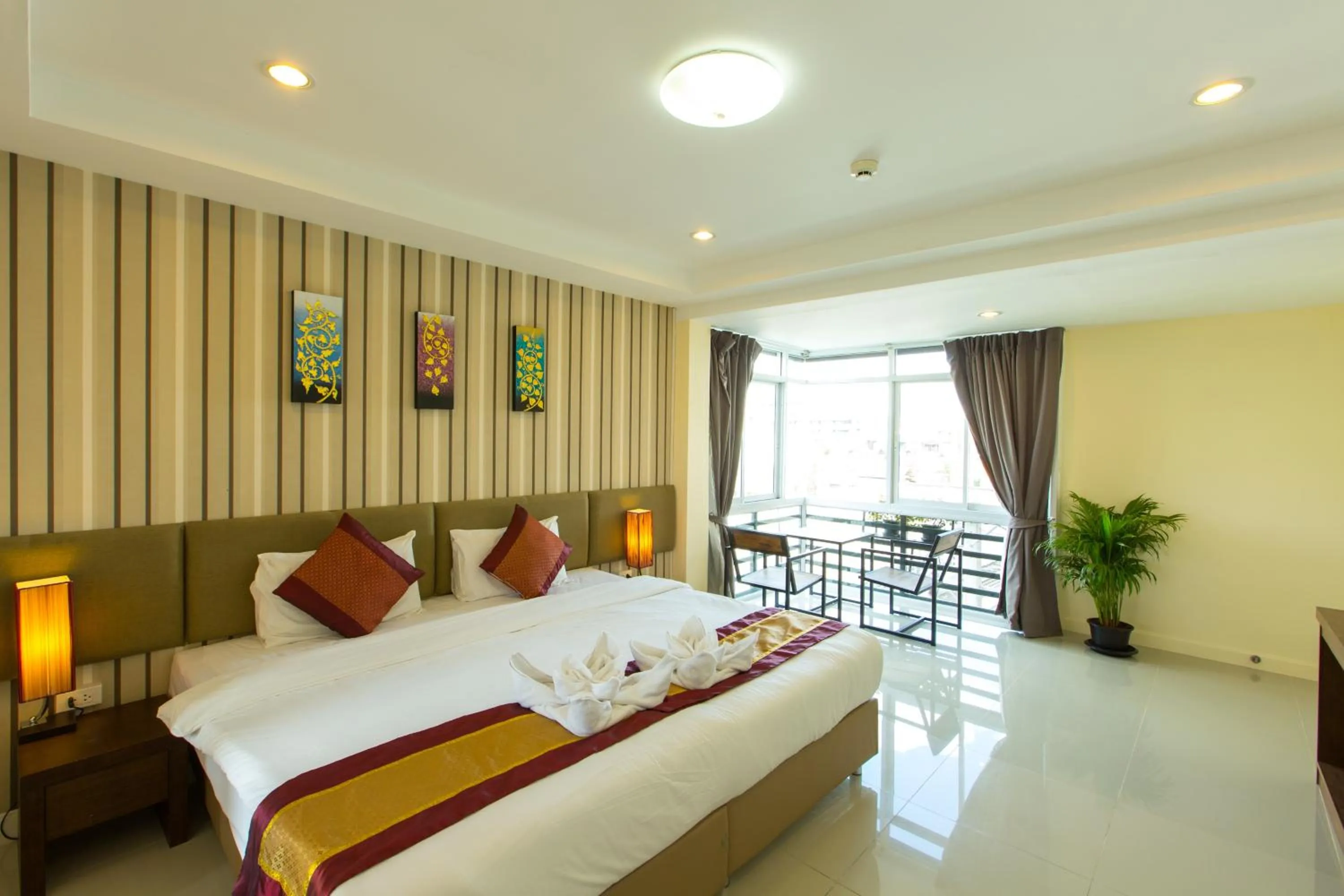 Photo of the whole room, Bed in Chiang Mai Waroros Boutique Hotel