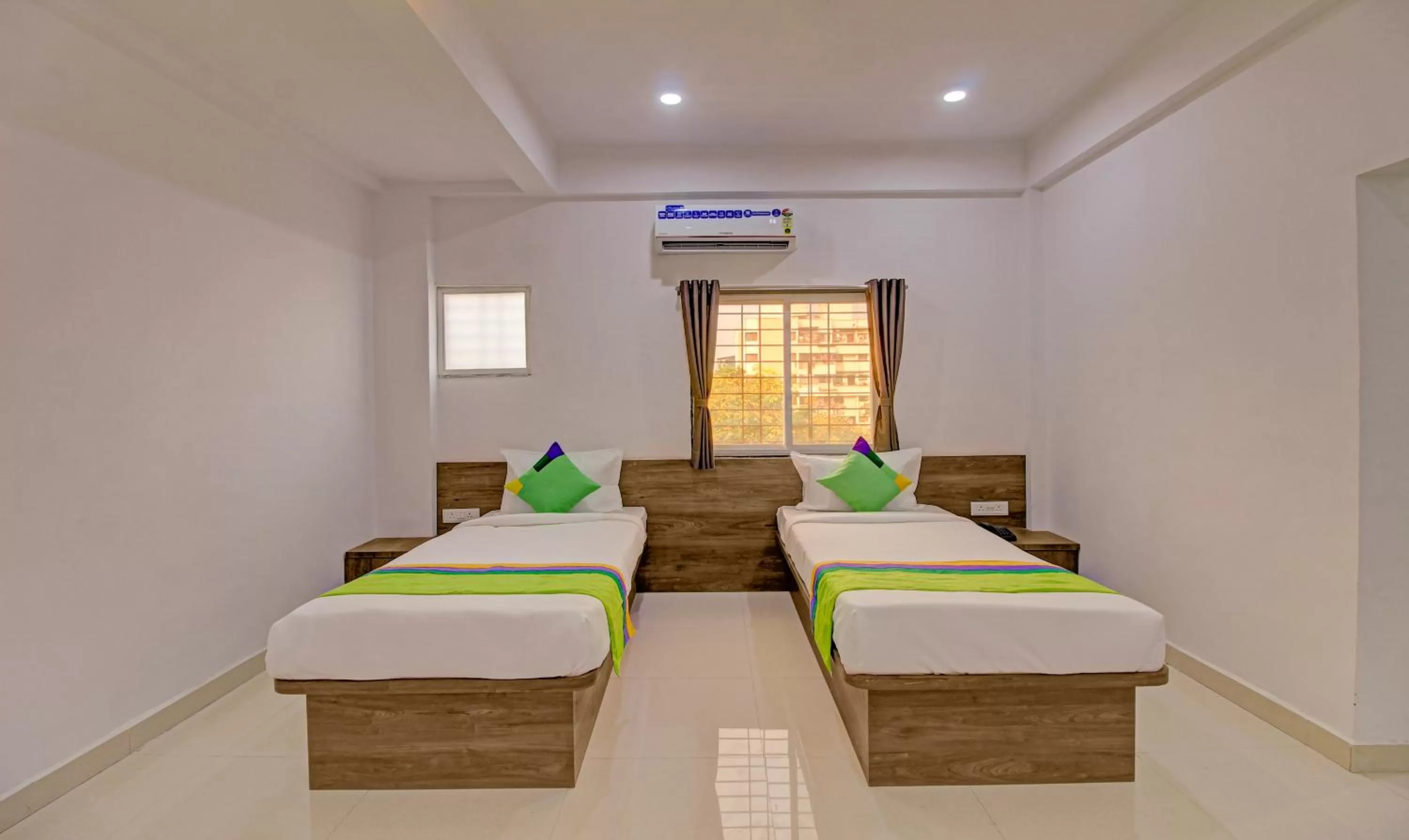 Bed in Treebo Trend White House