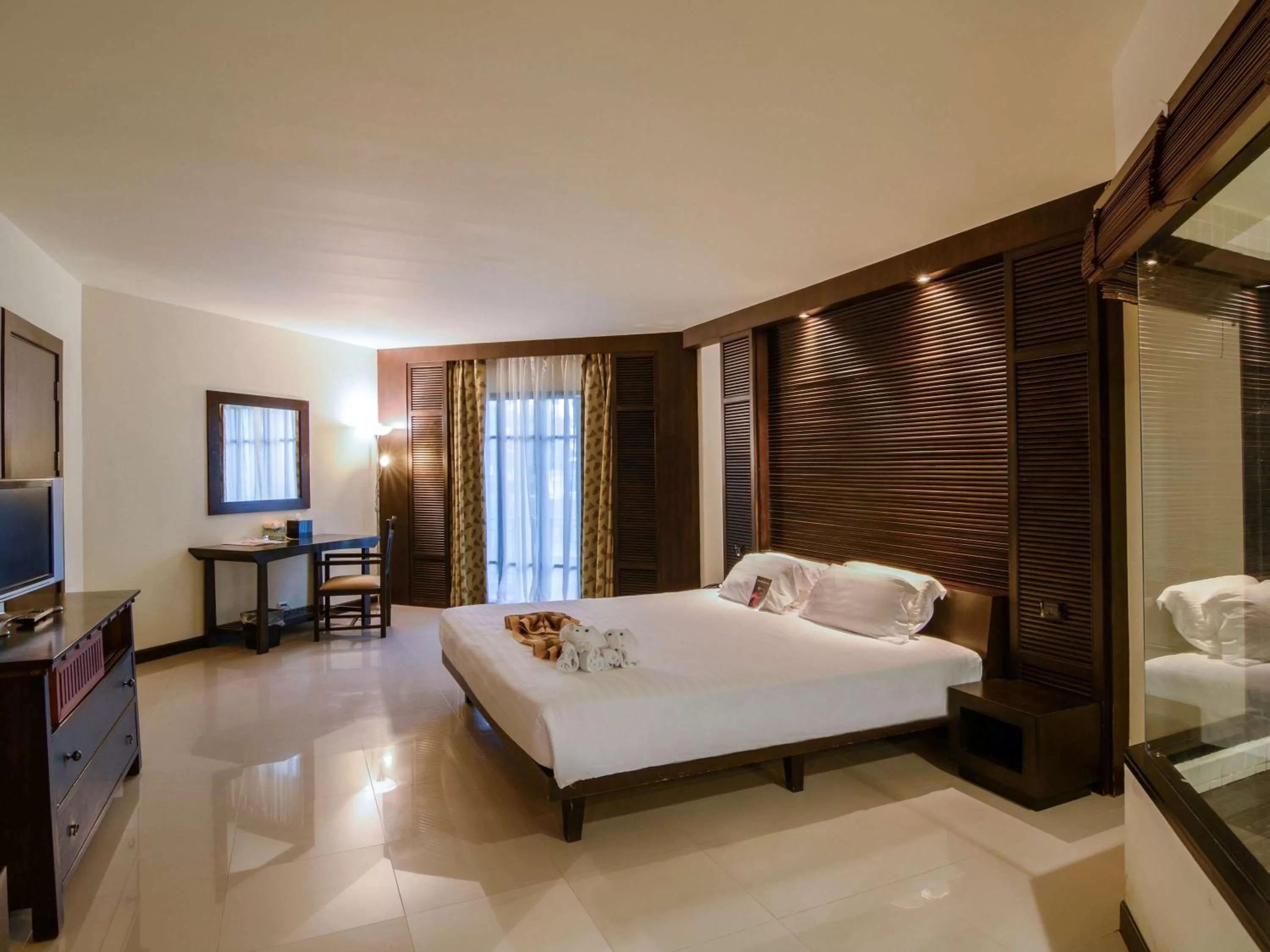 Photo of the whole room, Bed in The Nouveau Chumphon Beach Resort And Golf