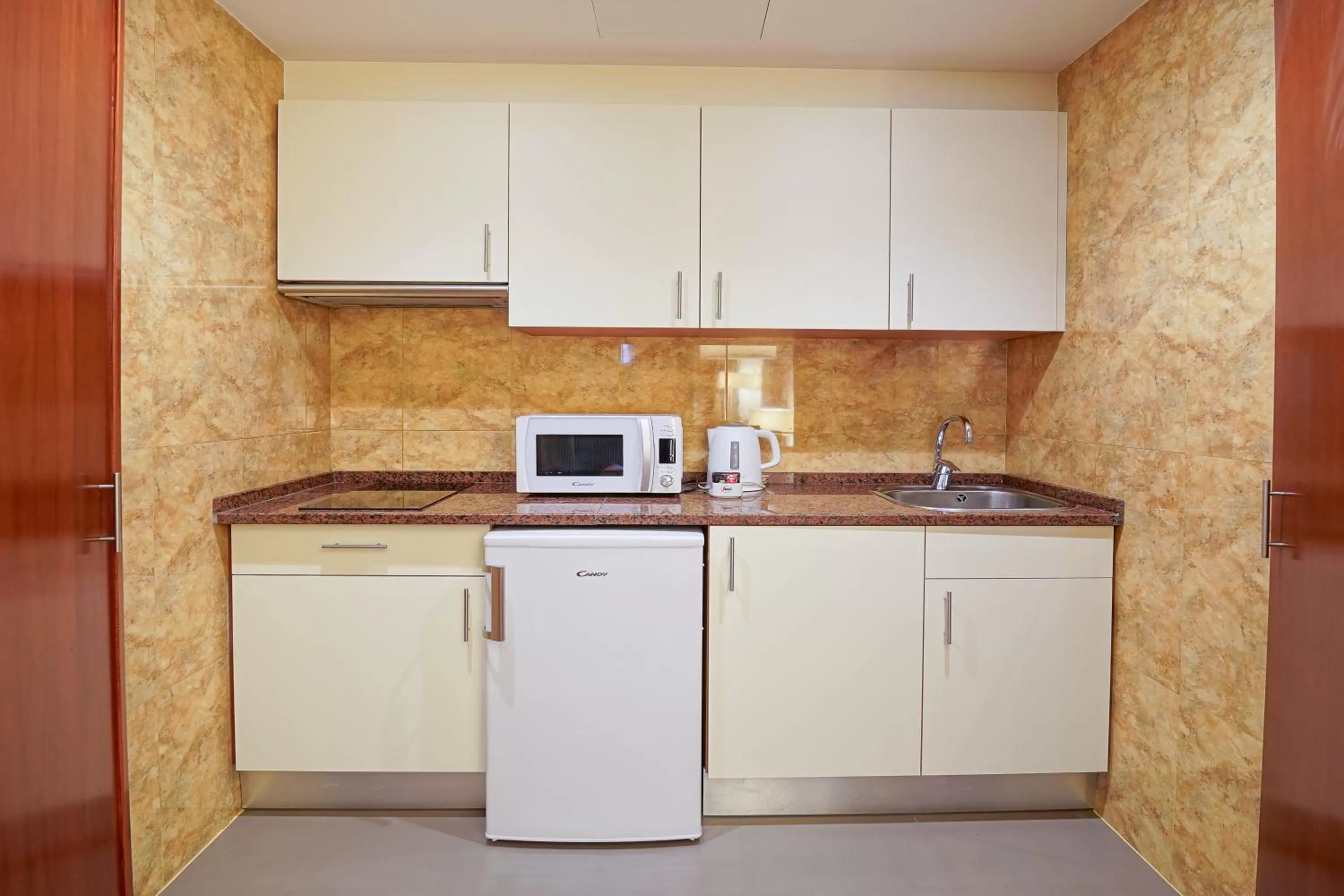 Kitchen or kitchenette in Legendary Lisboa Suites