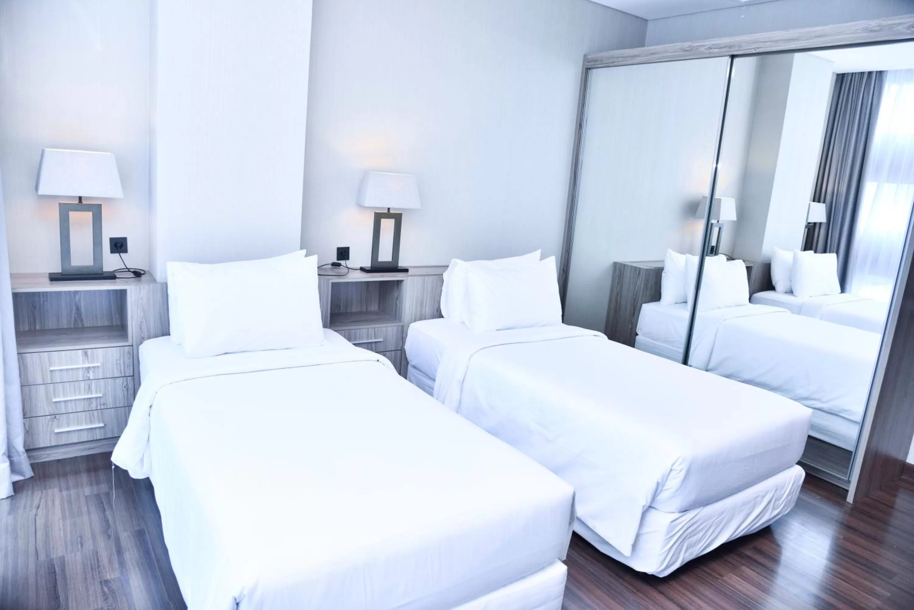 Bed in Azana Suites Hotel Antasari