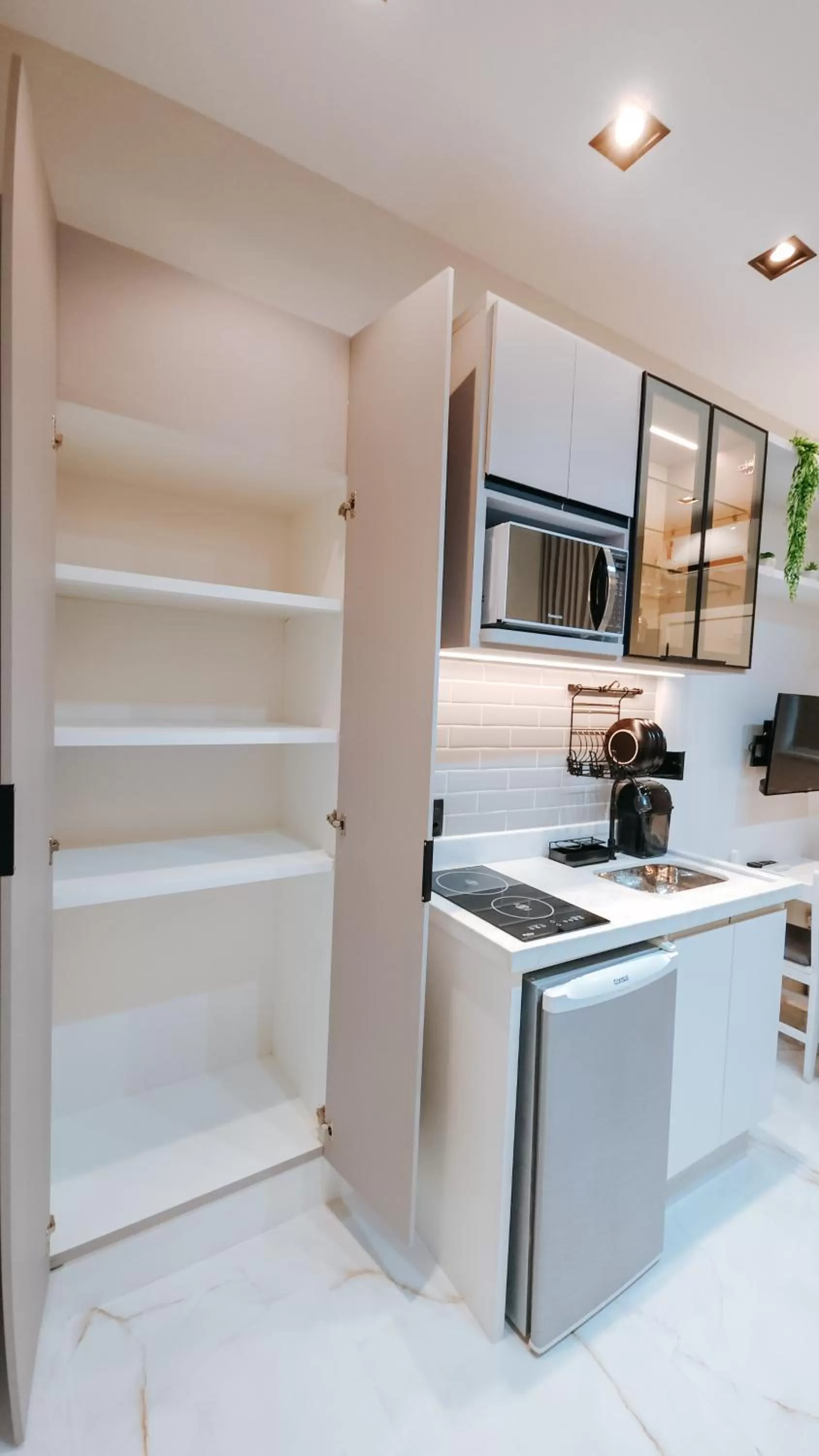 Kitchen or kitchenette in Suítes Água Marinha