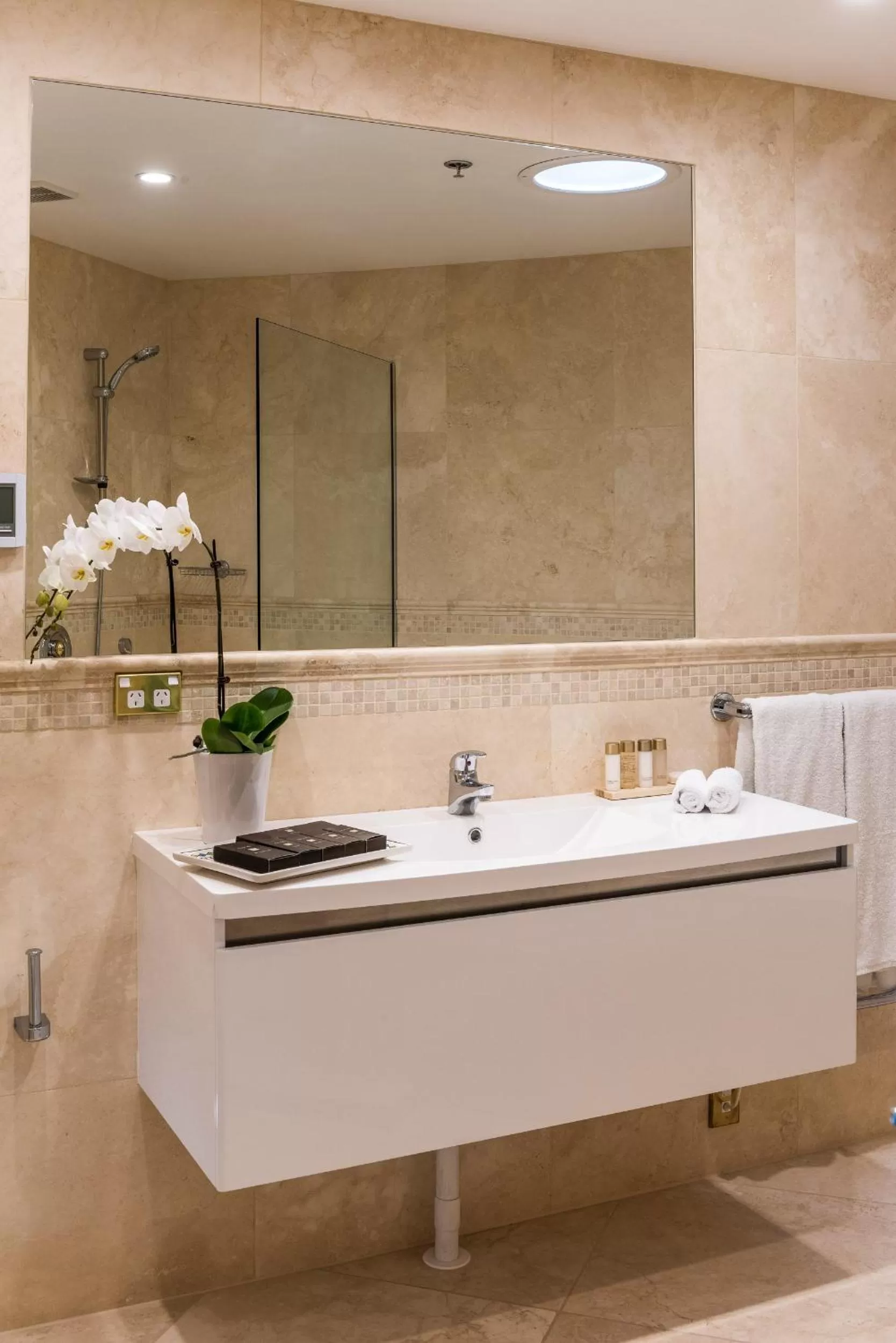 Bathroom in Fino Hotel & Suites