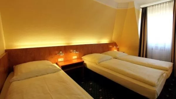 Bed in Aparthotel Astro - Nichtraucherhotel