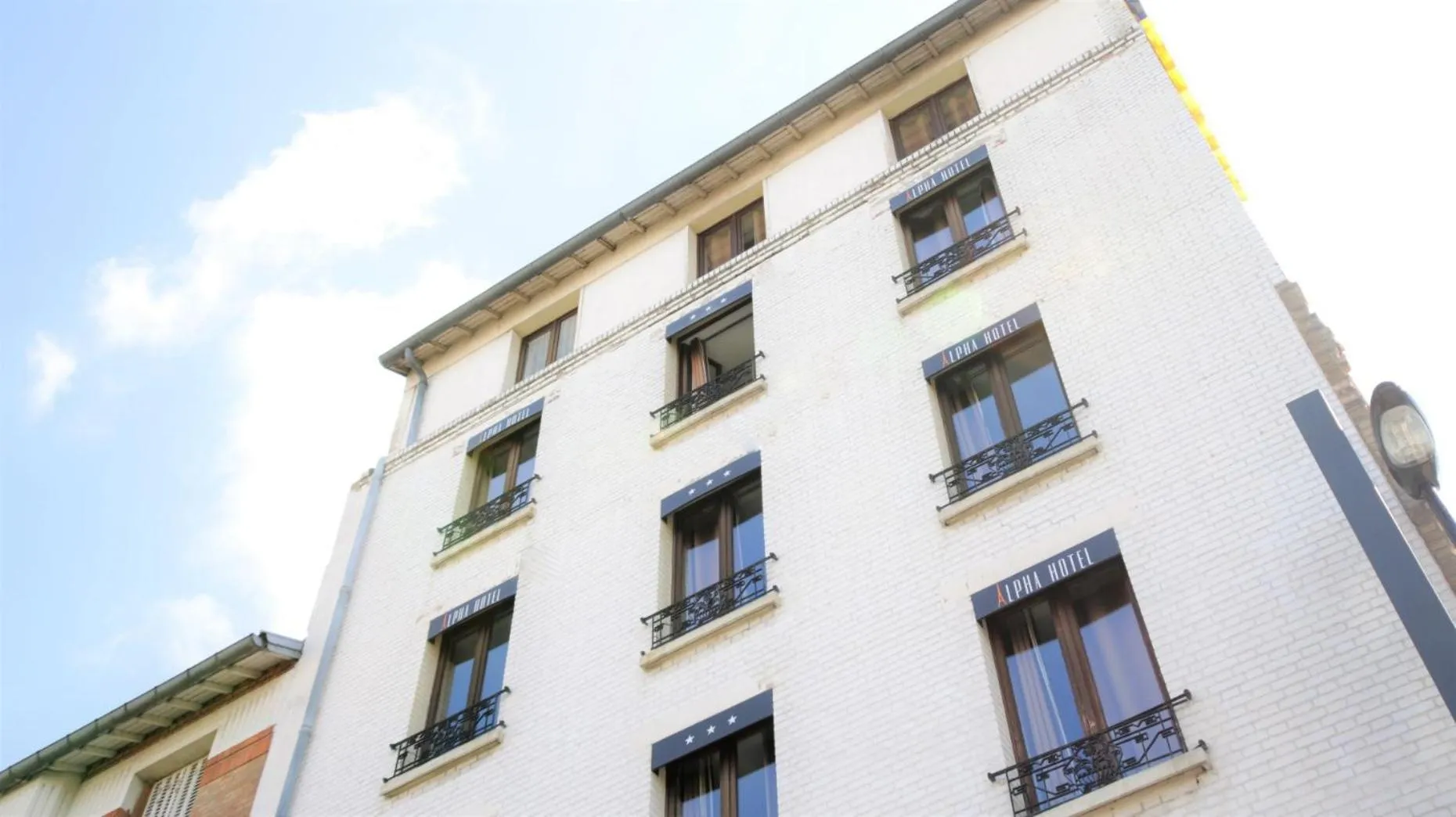 Facade/entrance in Hotel Alpha Paris Eiffel by Patrick Hayat