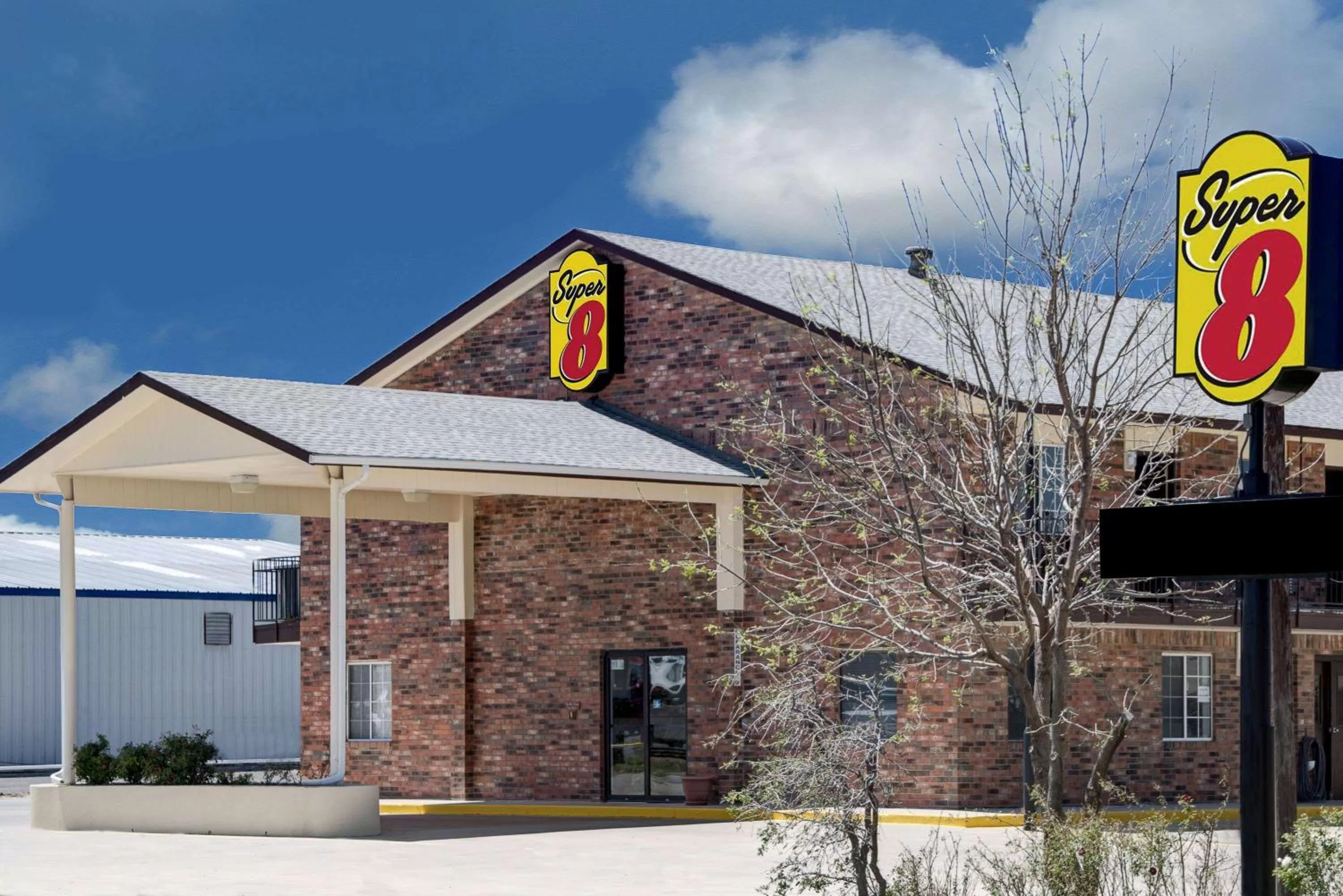 Property building in Super 8 by Wyndham Dumas TX