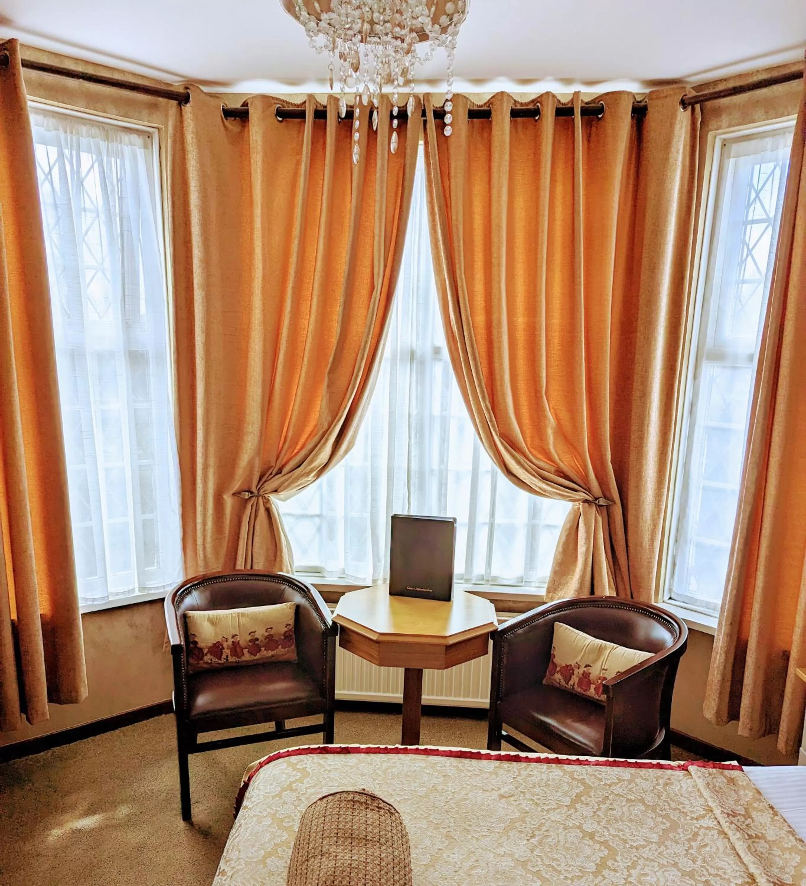 Seating area in Brookside Hotel & Restaurant ,Suitable for Solo Travelers Couples Educational Groups & Families welcome