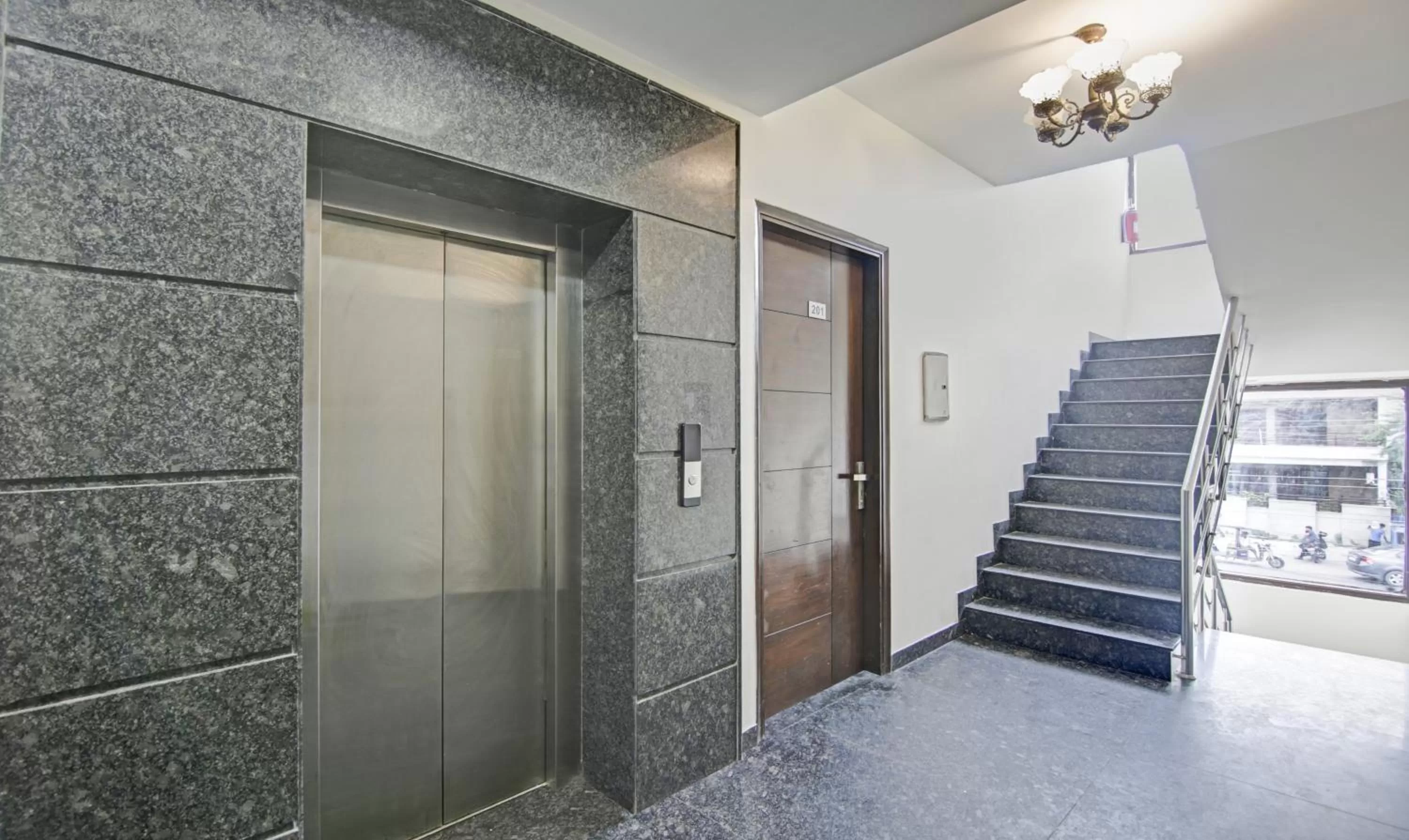 elevator, Bathroom in Treebo Trend Apple Pie