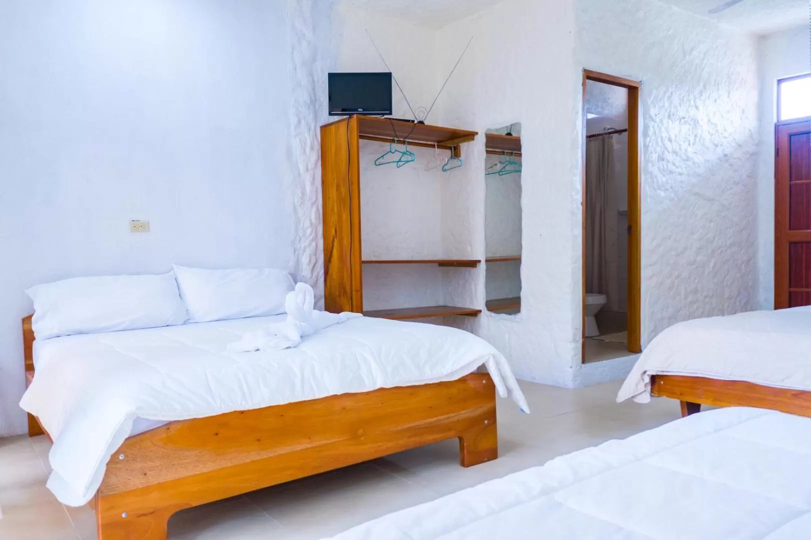 Bed in Royal Galápagos Inn