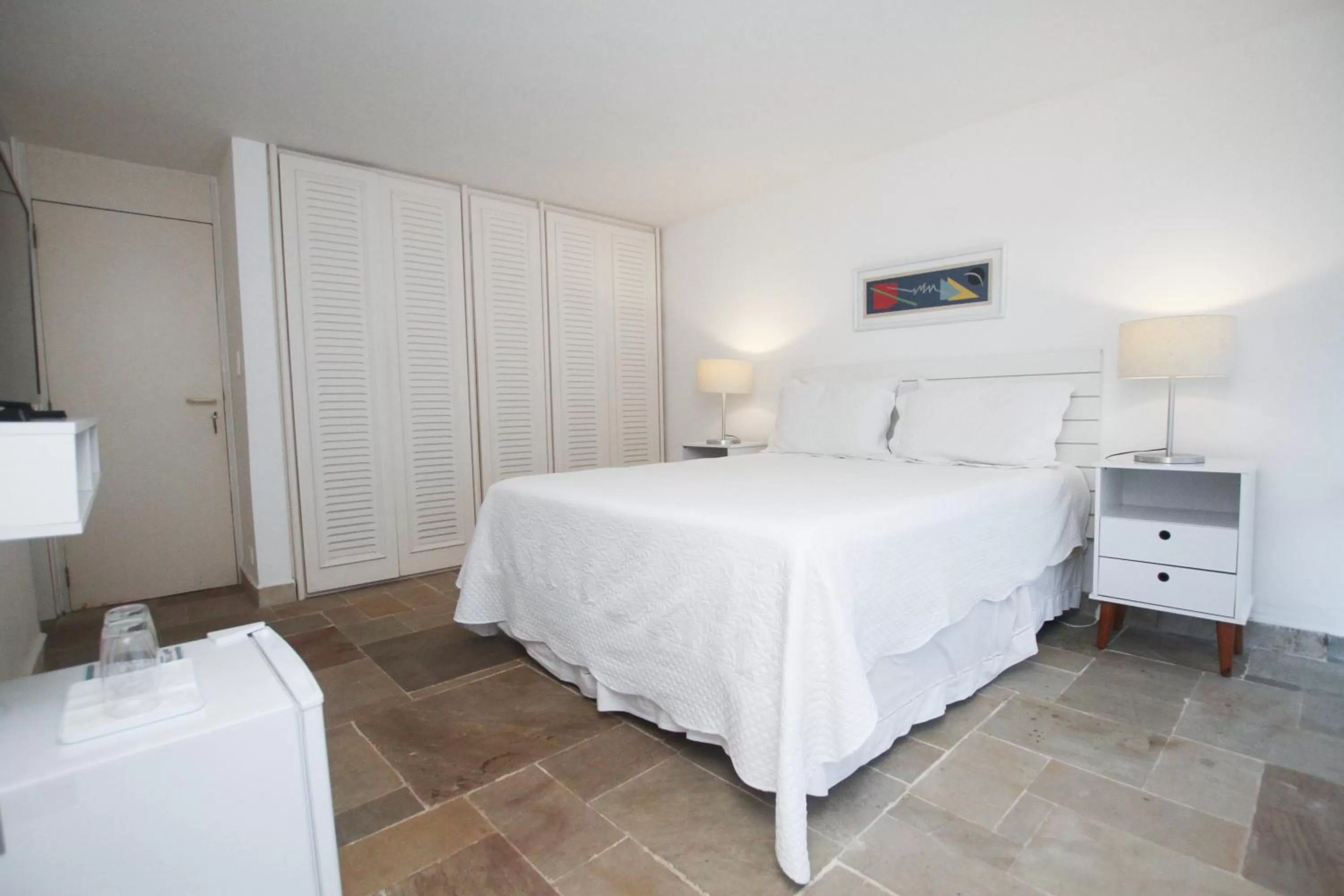 Bed in Guest House Guarujá