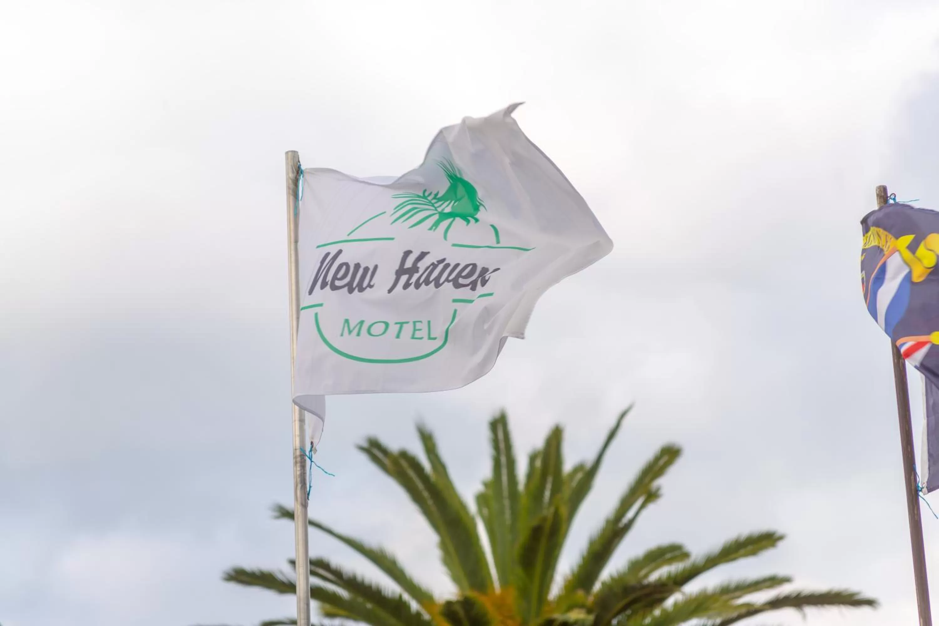 Property logo or sign in New Haven Motel