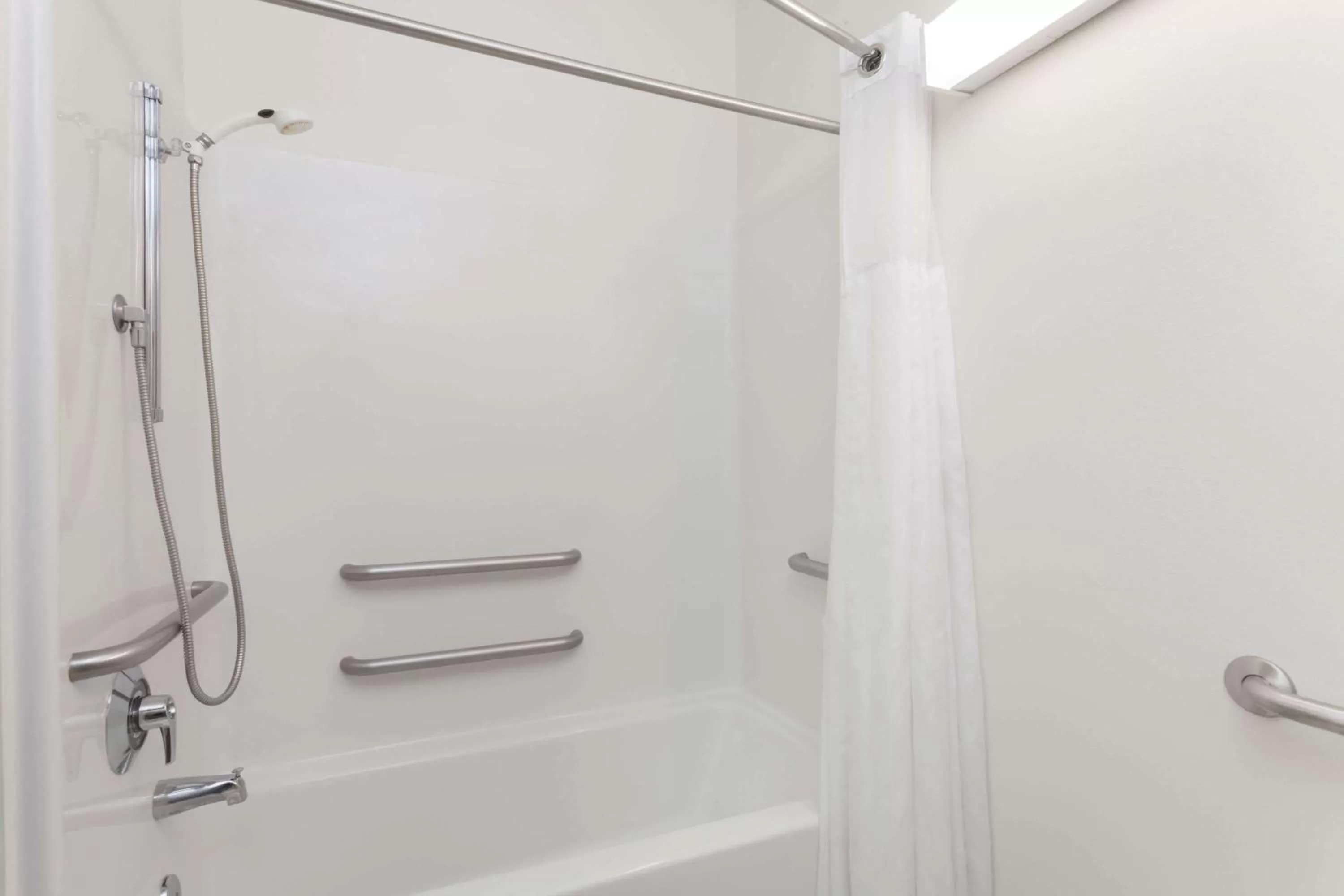 Bathroom in Days Inn & Suites by Wyndham Cambridge