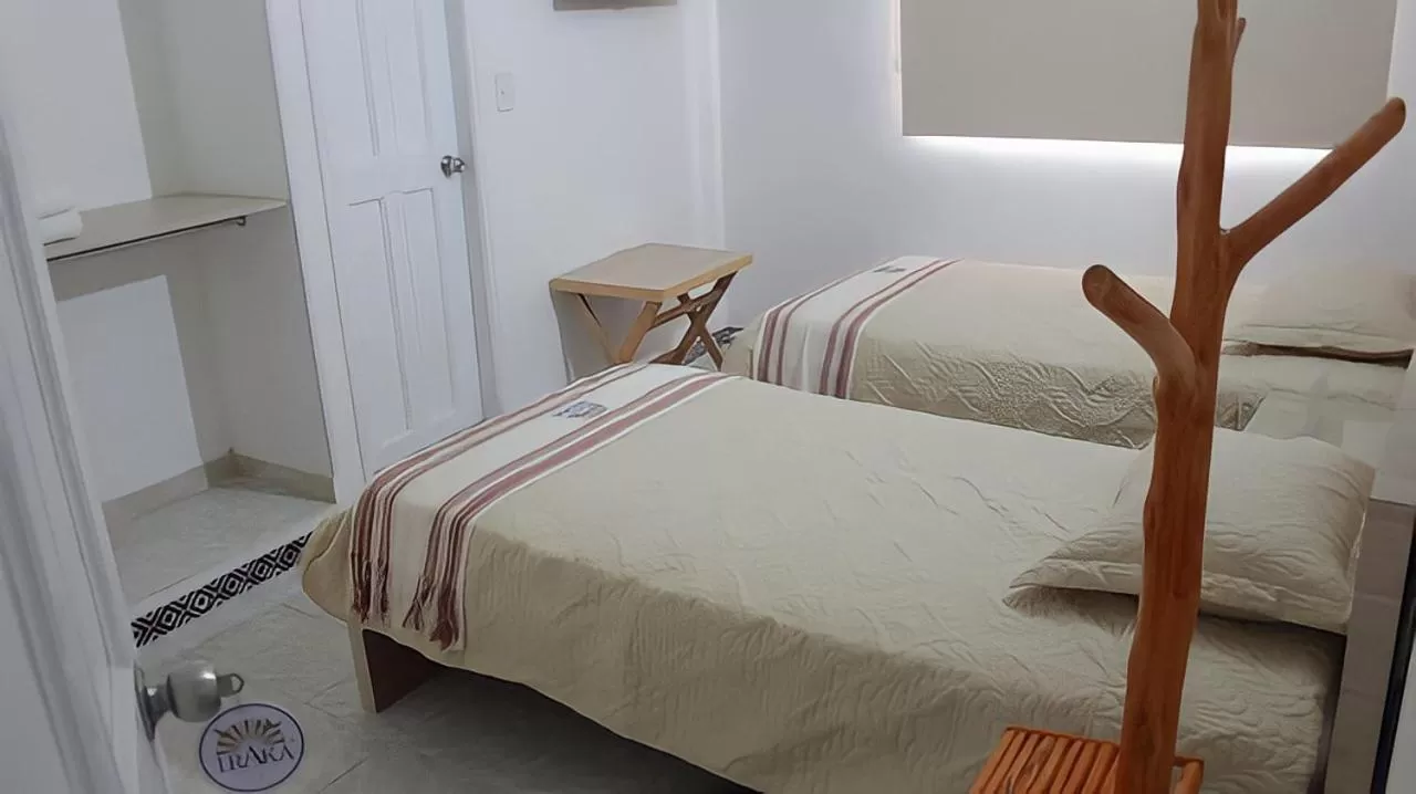 Bed in Hotel Iraka Zenu