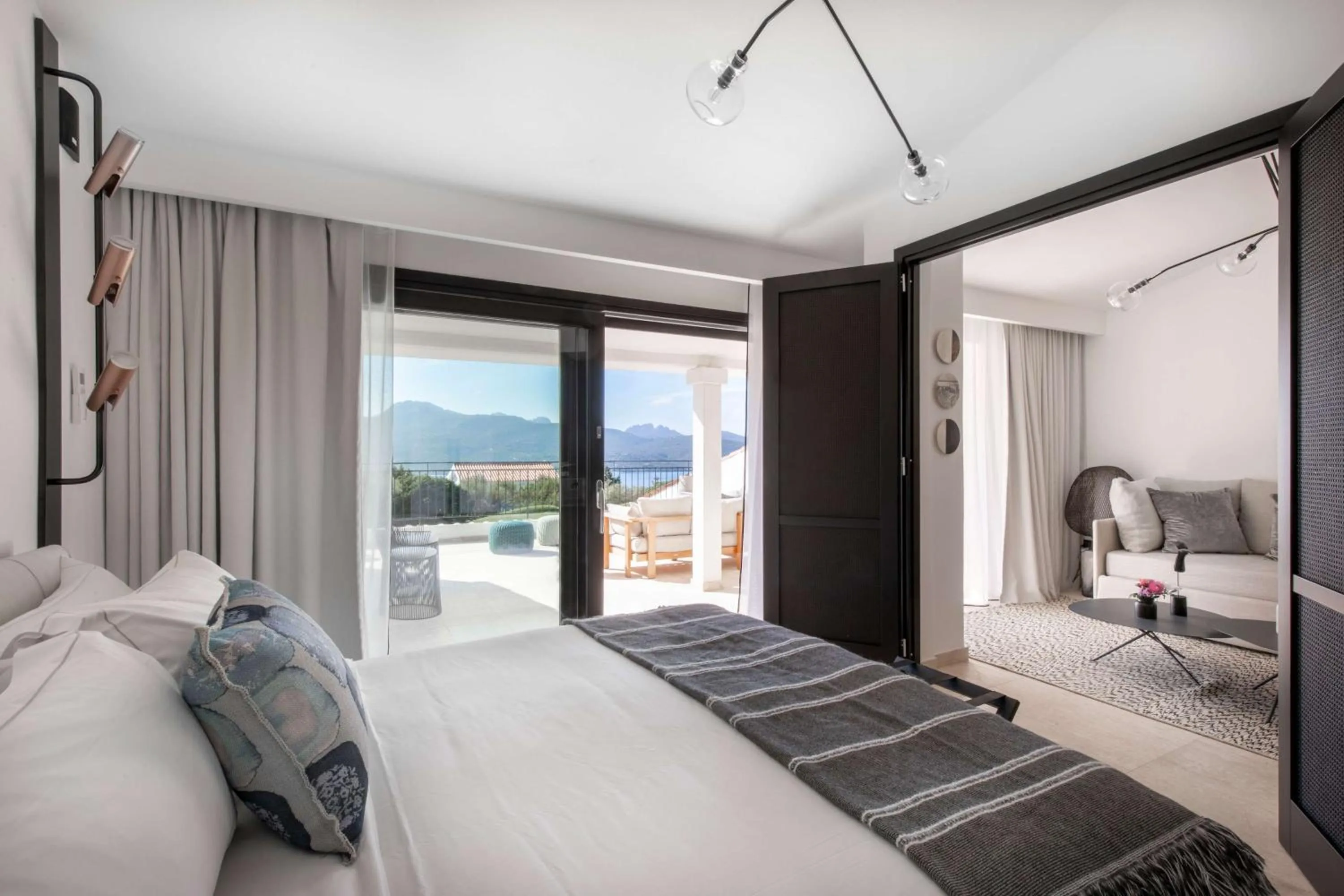 Living room, Bed in Sulià House Porto Rotondo, Curio Collection by Hilton