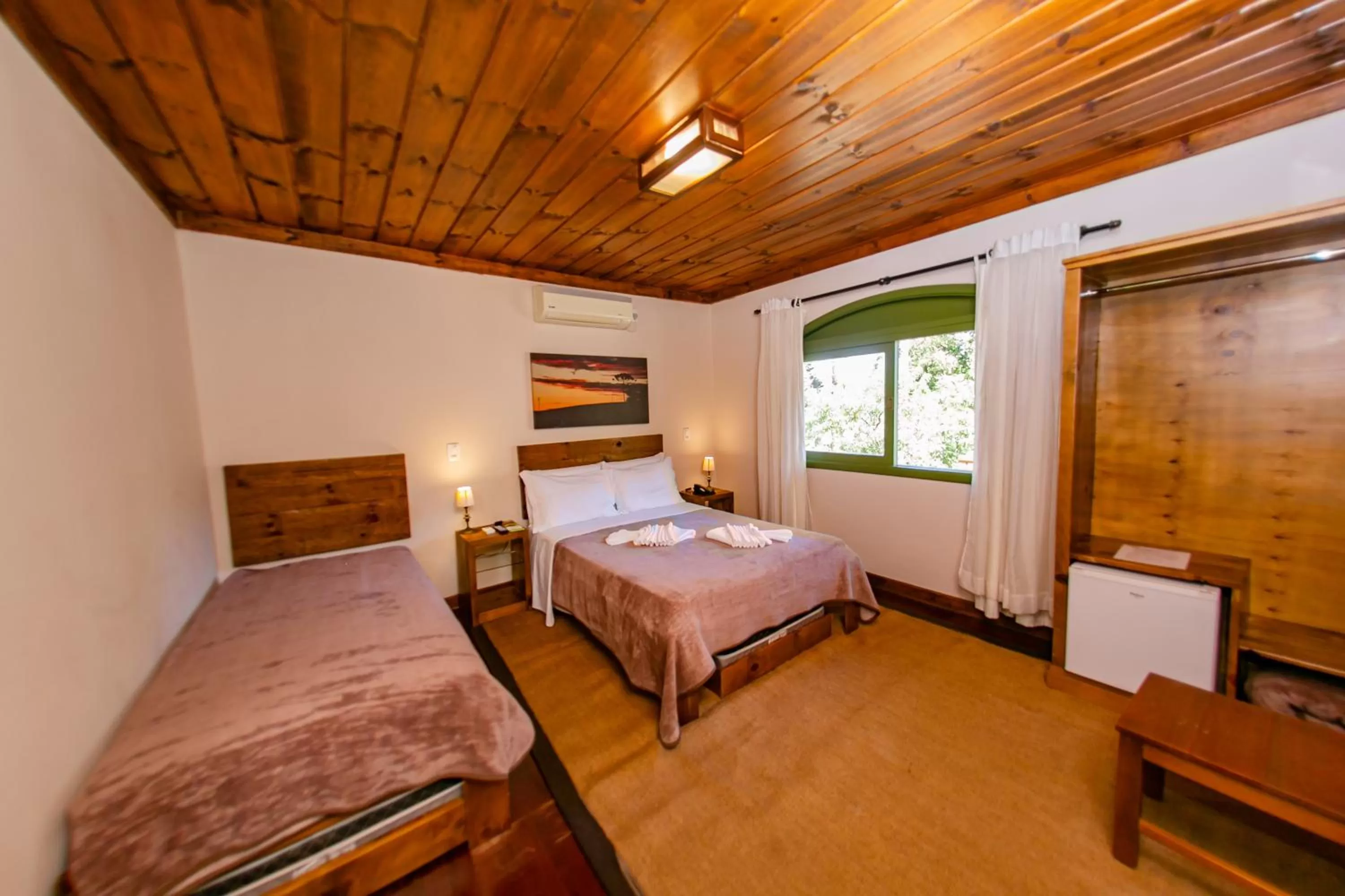 Bed in Pousada Charm Canela