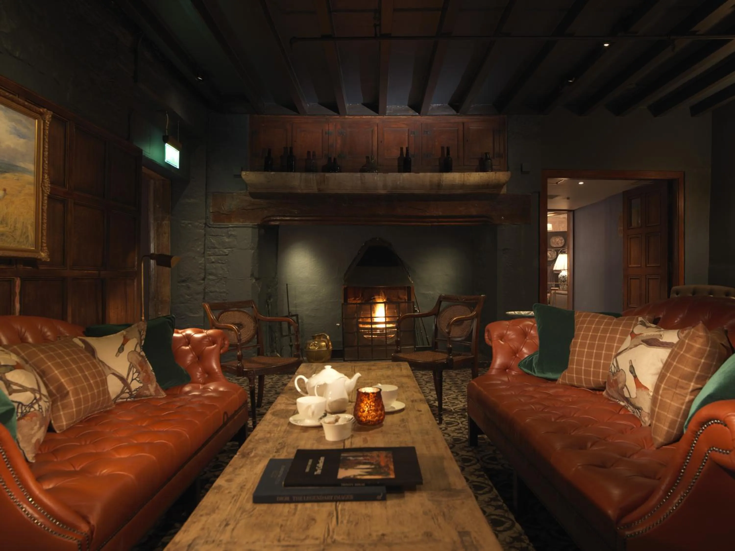 Communal lounge/ TV room in The Lygon Arms - an Iconic Luxury Hotel