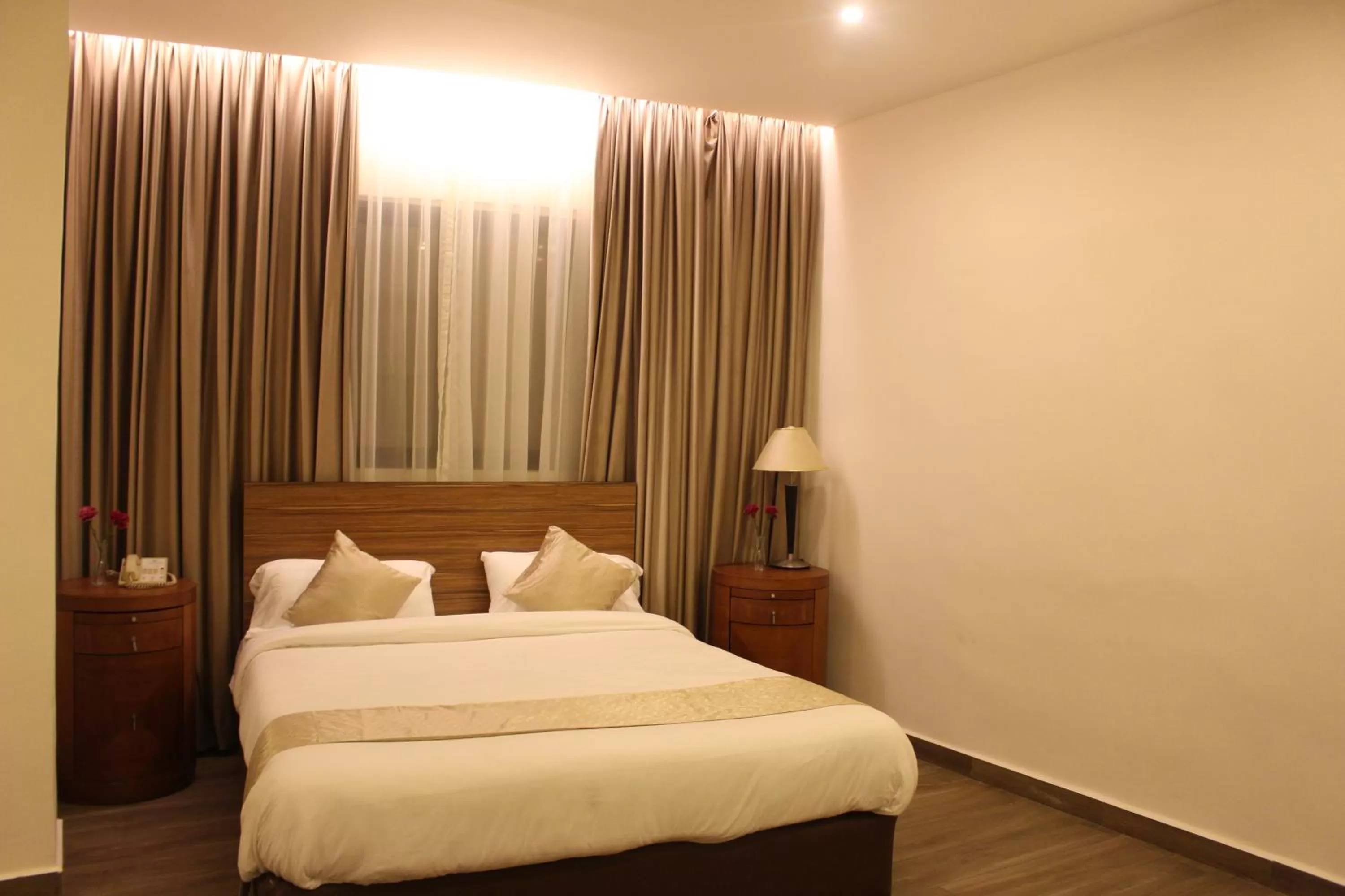 Bed in New MerryLand Hotel