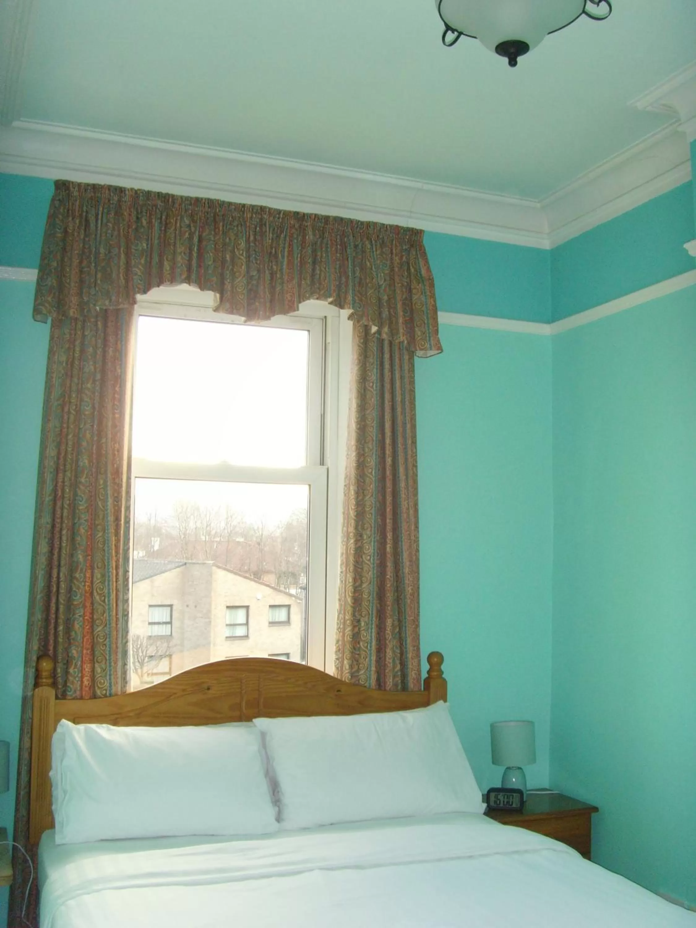 Bed in Twin Lions Hotel