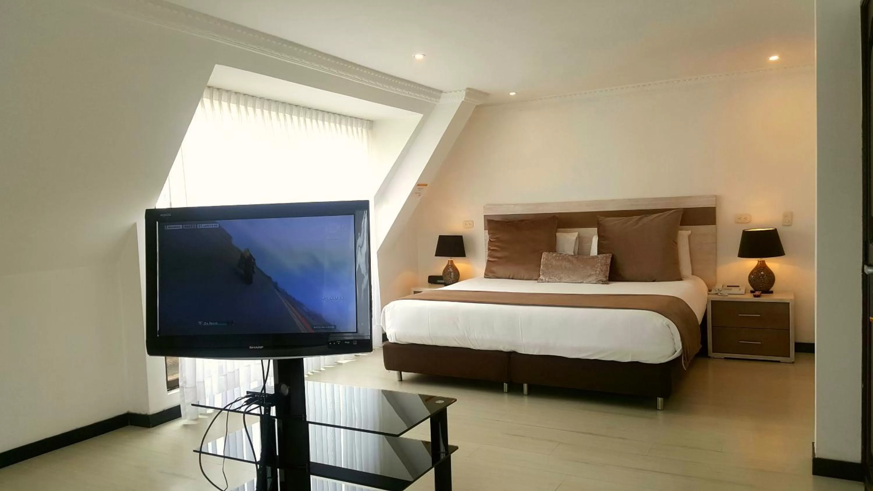 Bedroom, TV/Entertainment Center in Suites 109 GH Usaquén