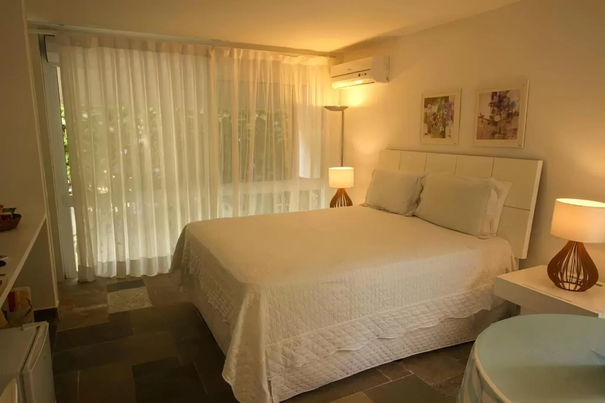 Bed in Guest House Guarujá