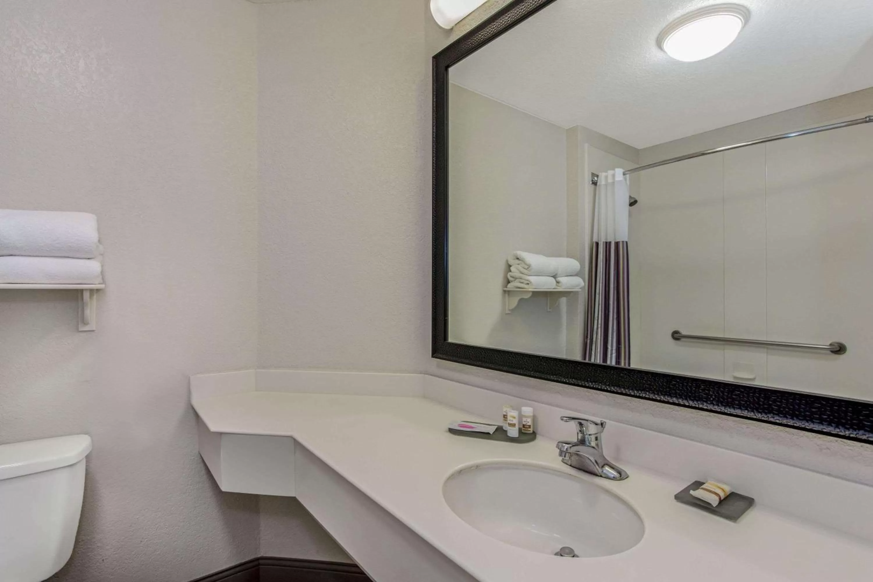 Bathroom in La Quinta by Wyndham Orlando Airport North - Free Airport Shuttle!