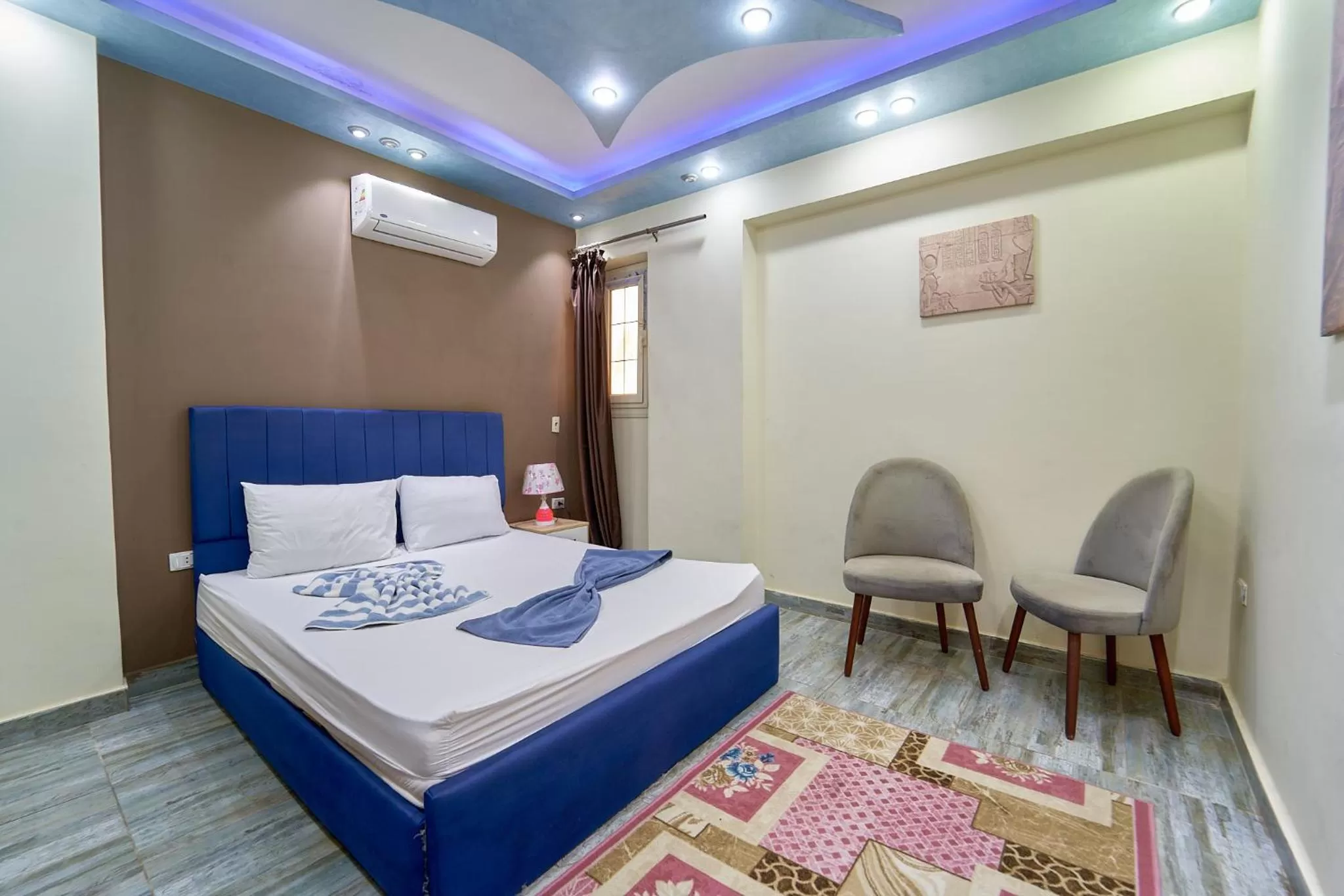 Living room, Bed in Gardenia Inn Hotel