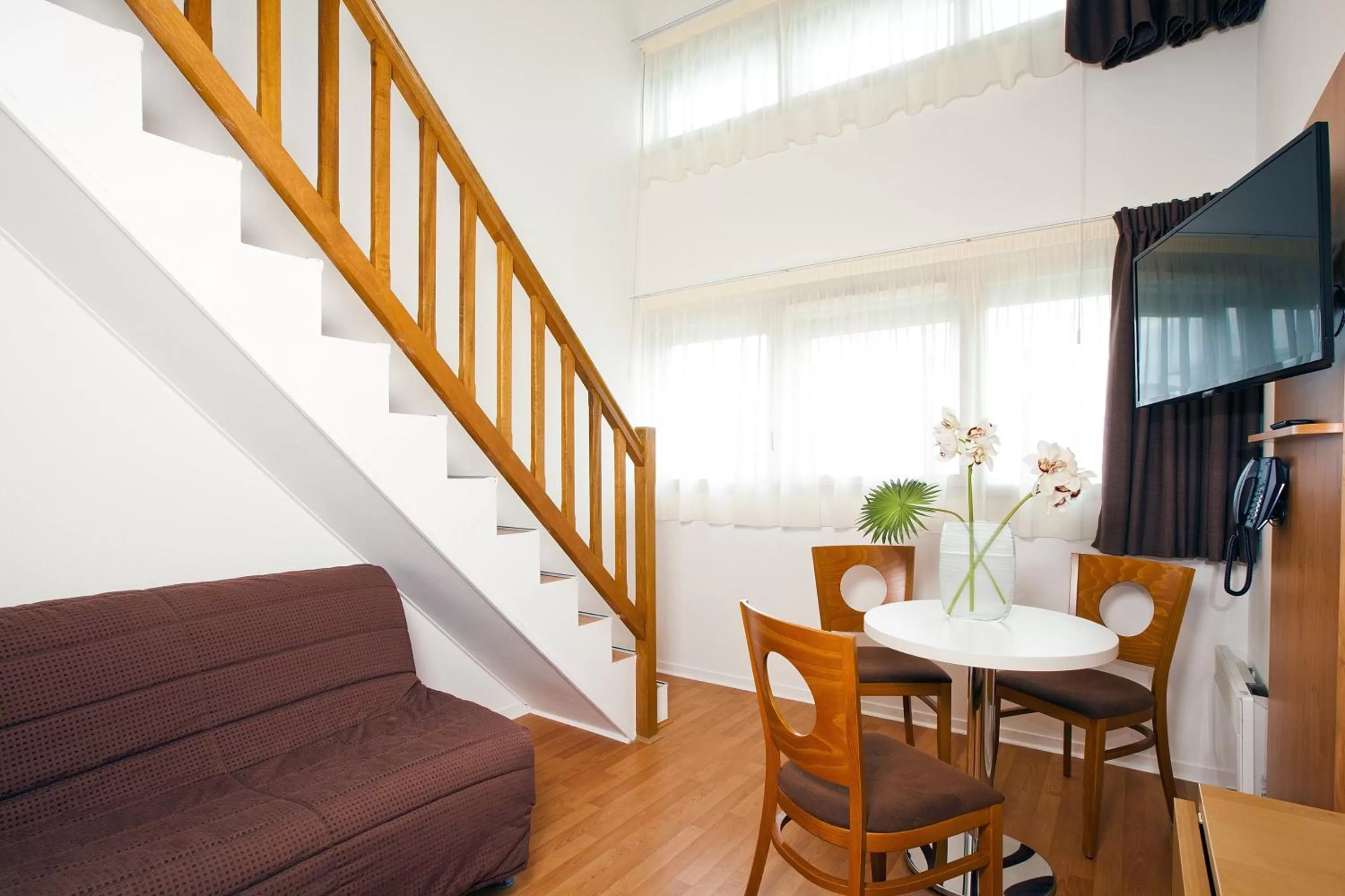 Bed in Séjours & Affaires Nantes Ducs De Bretagne