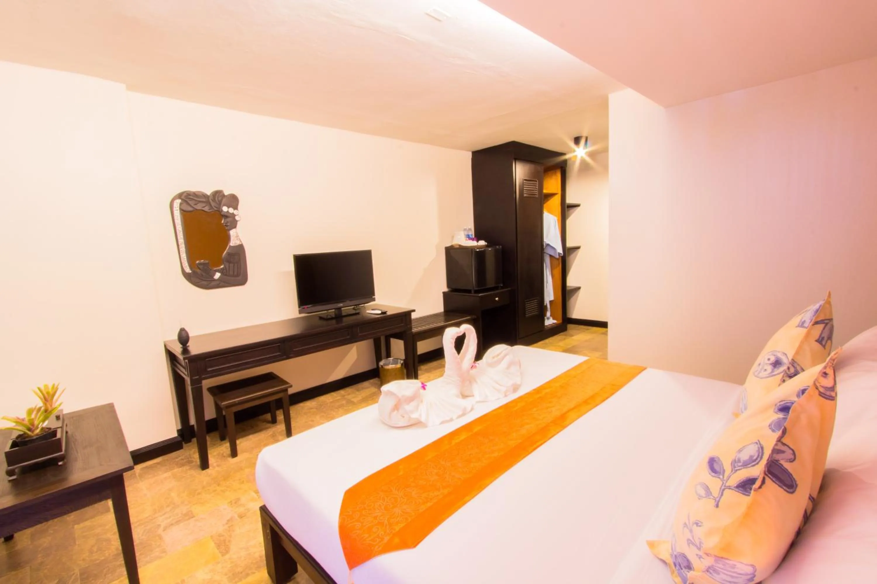 Bed in All Together Suite Hotel