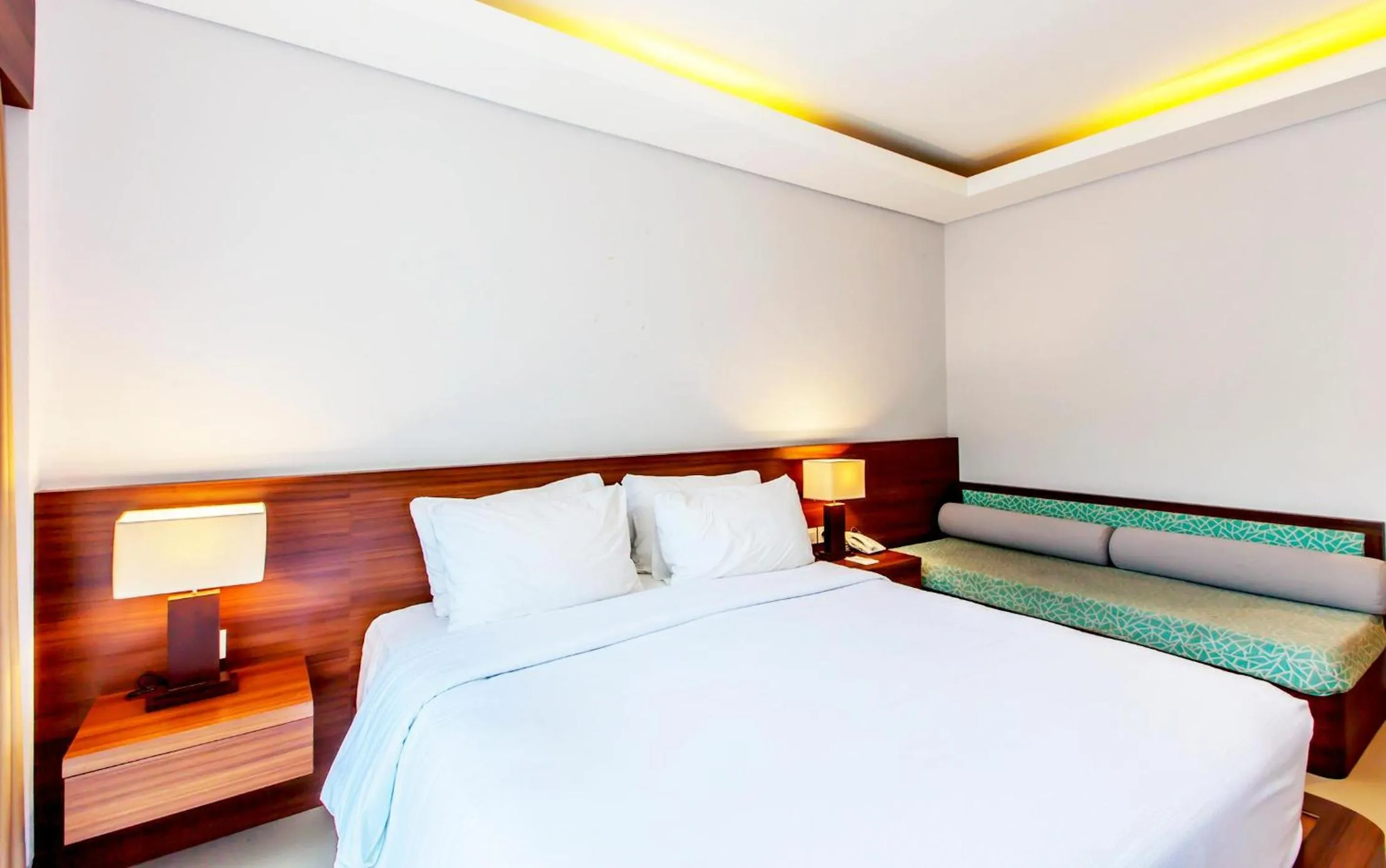 Bed in Grand Mirah Boutique Hotel