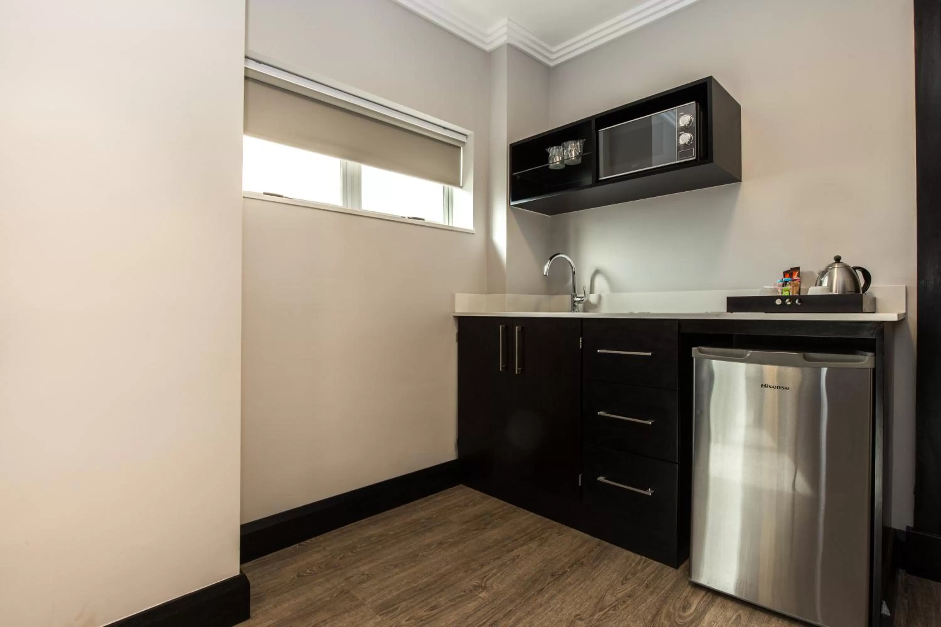 Kitchen or kitchenette in Belaire Suites Hotel