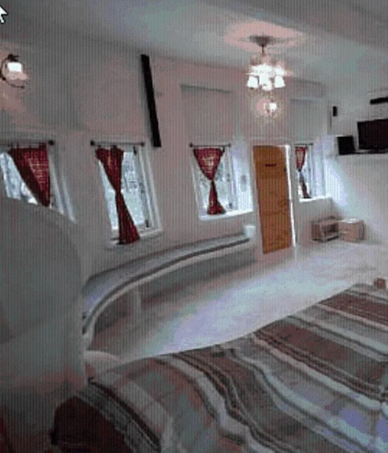 Bed in Scenic Riverside Resort