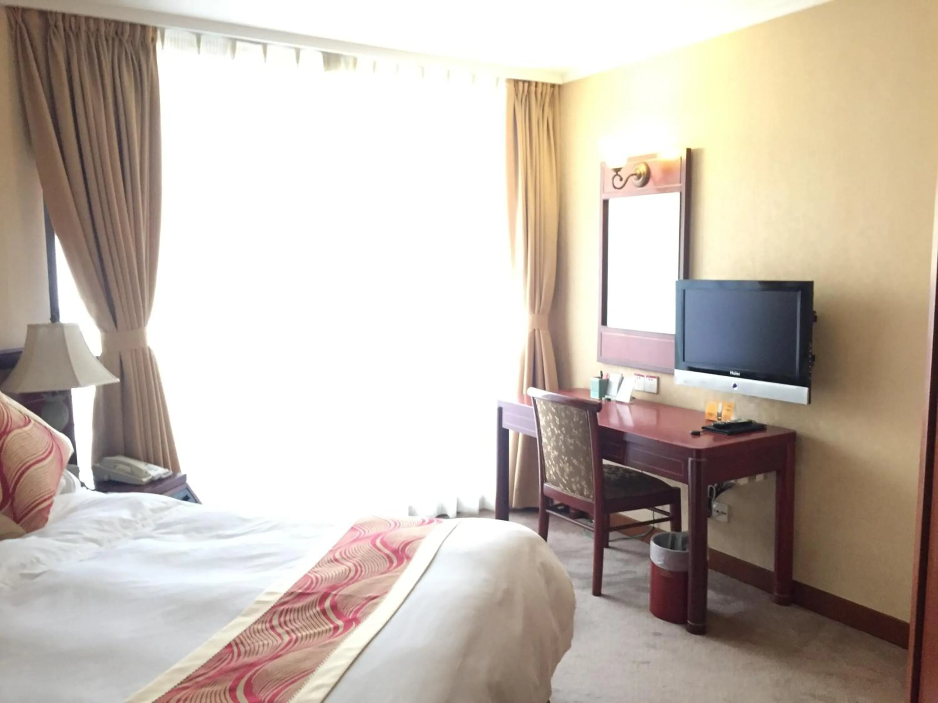 Bed in Huiquan Dynasty Hotel Qingdao