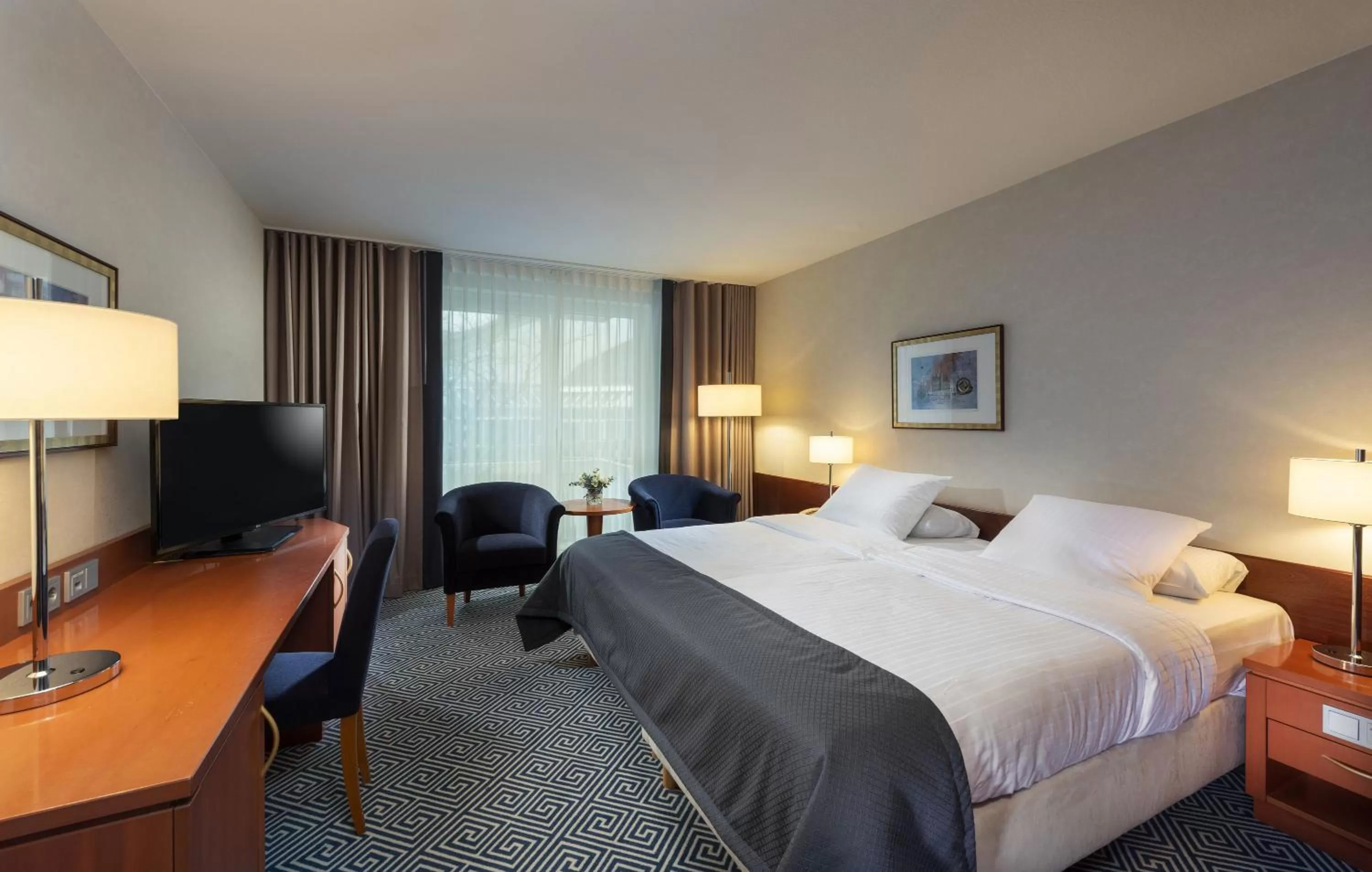 Photo of the whole room, Bed in Maritim Hotel Würzburg