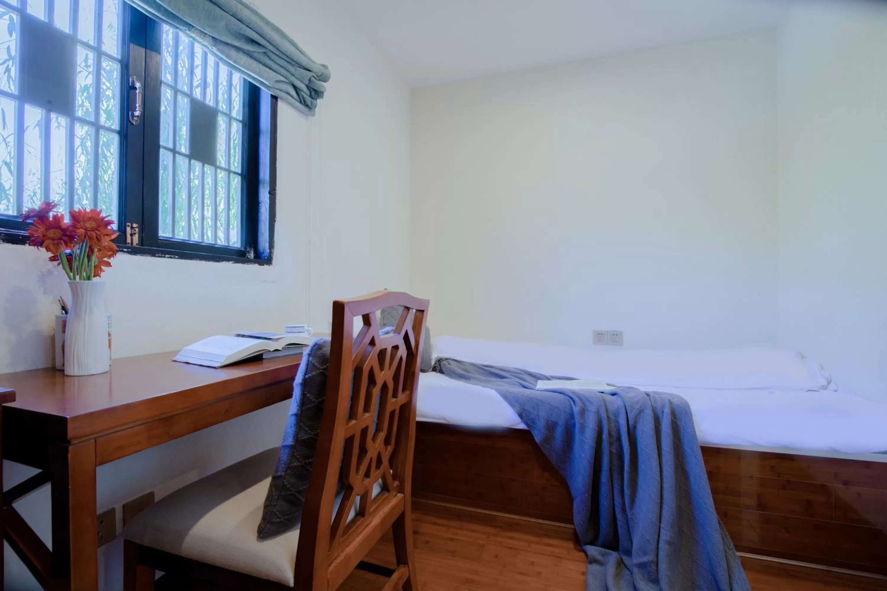 Bed in Lijiang Gemmer Hotel