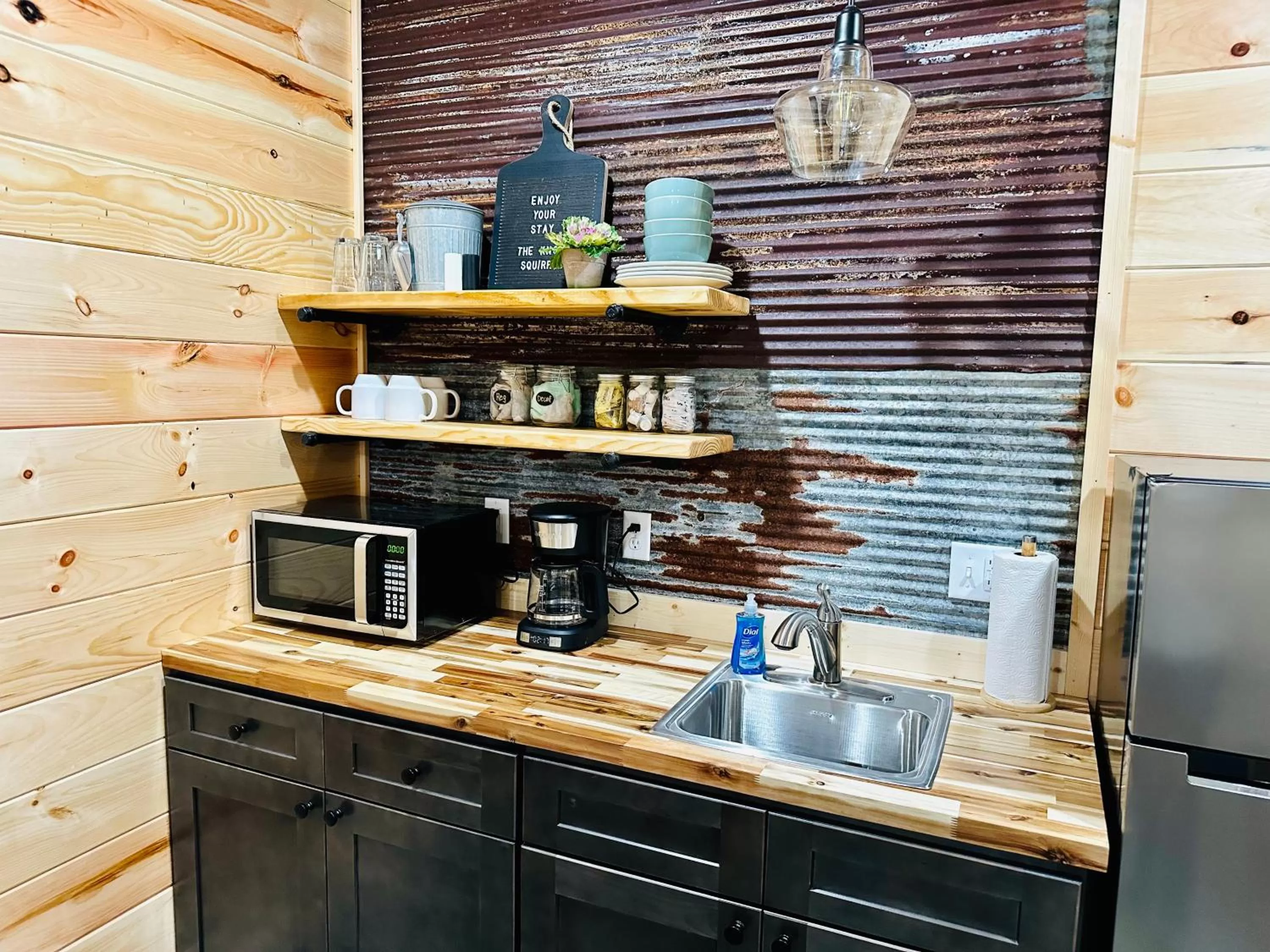 Kitchen or kitchenette in Knotty Squirrel Cabins