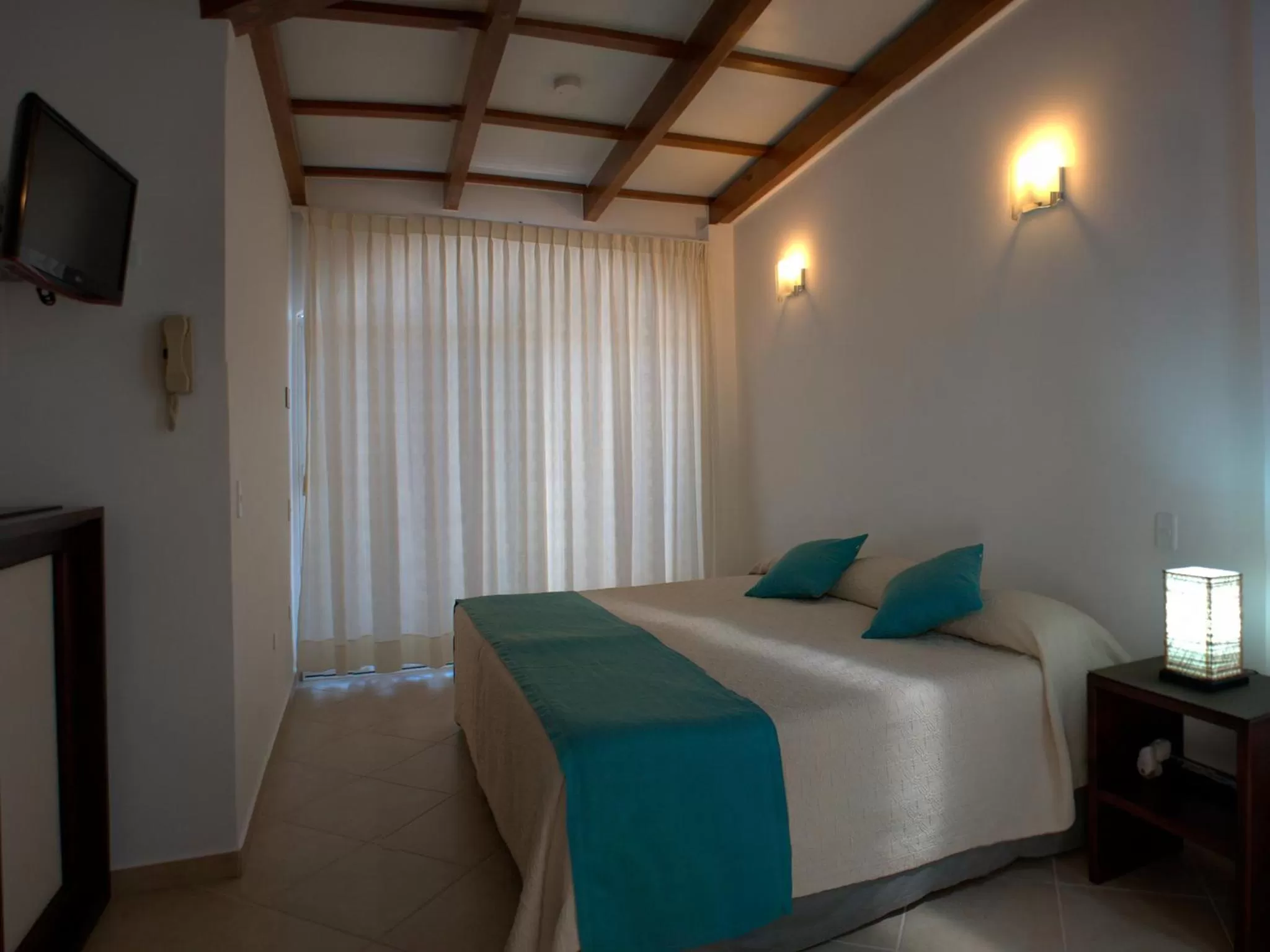 Bedroom, Bed in Hotel Galapagos Suites B&B