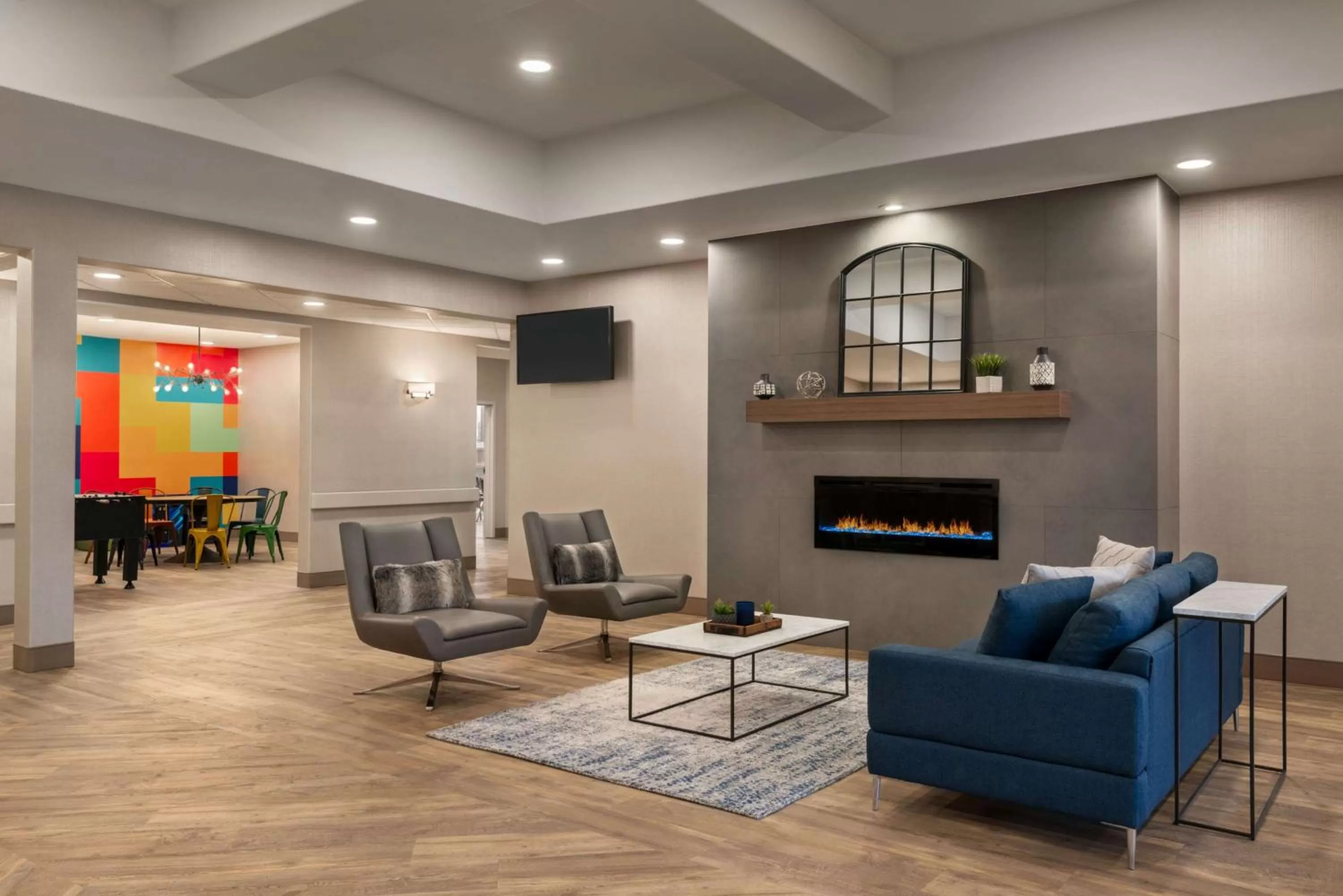 Lobby or reception in Ramada by Wyndham Airdrie Hotel & Suites