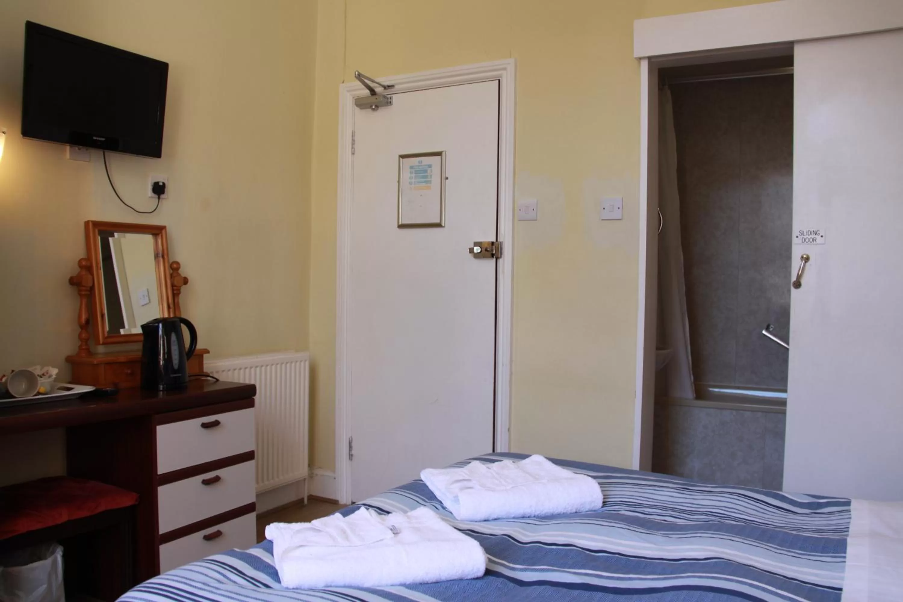 Bed in Ambassador Hotel