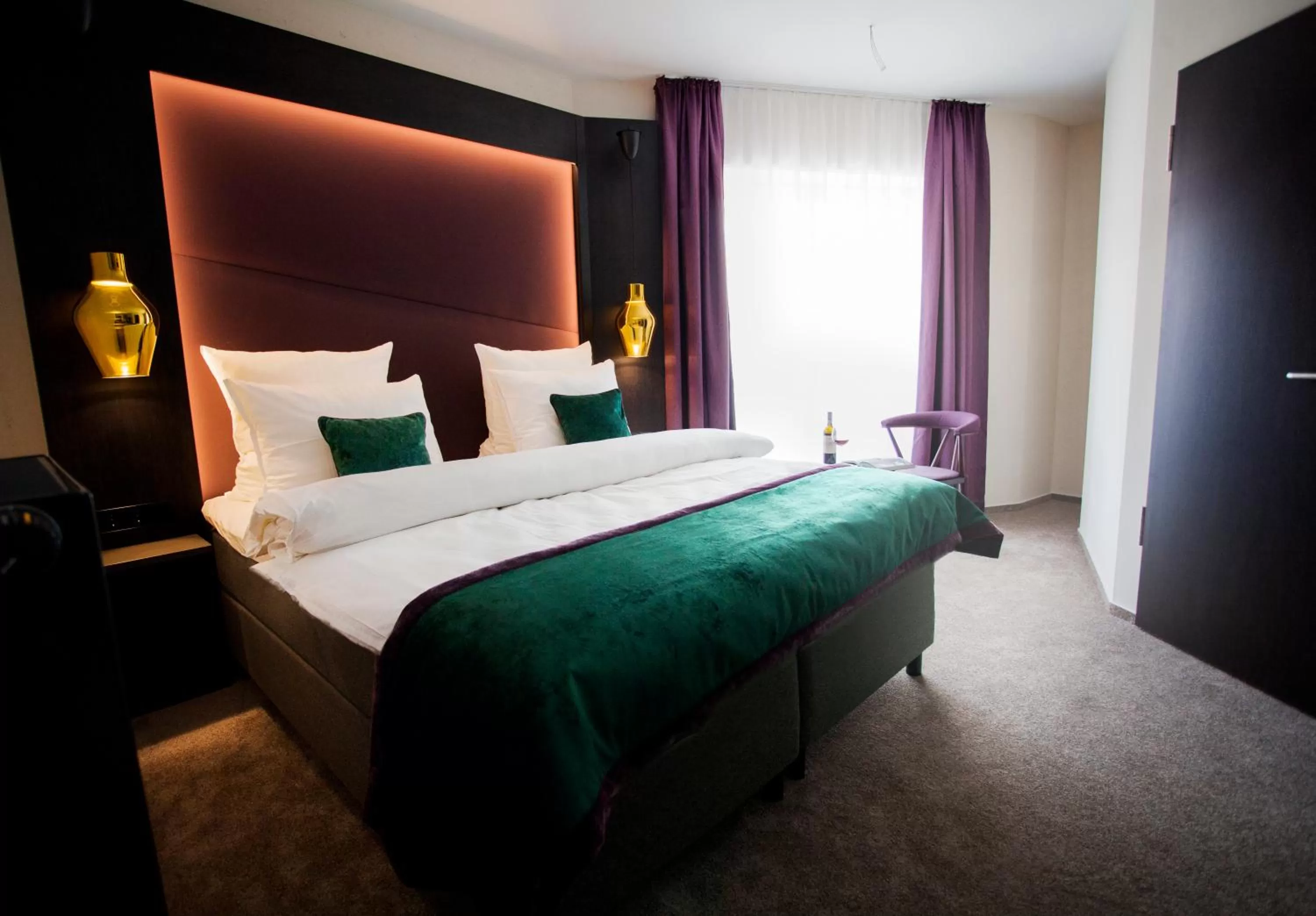 Bed in ONNO Boutique Hotel & Apartments